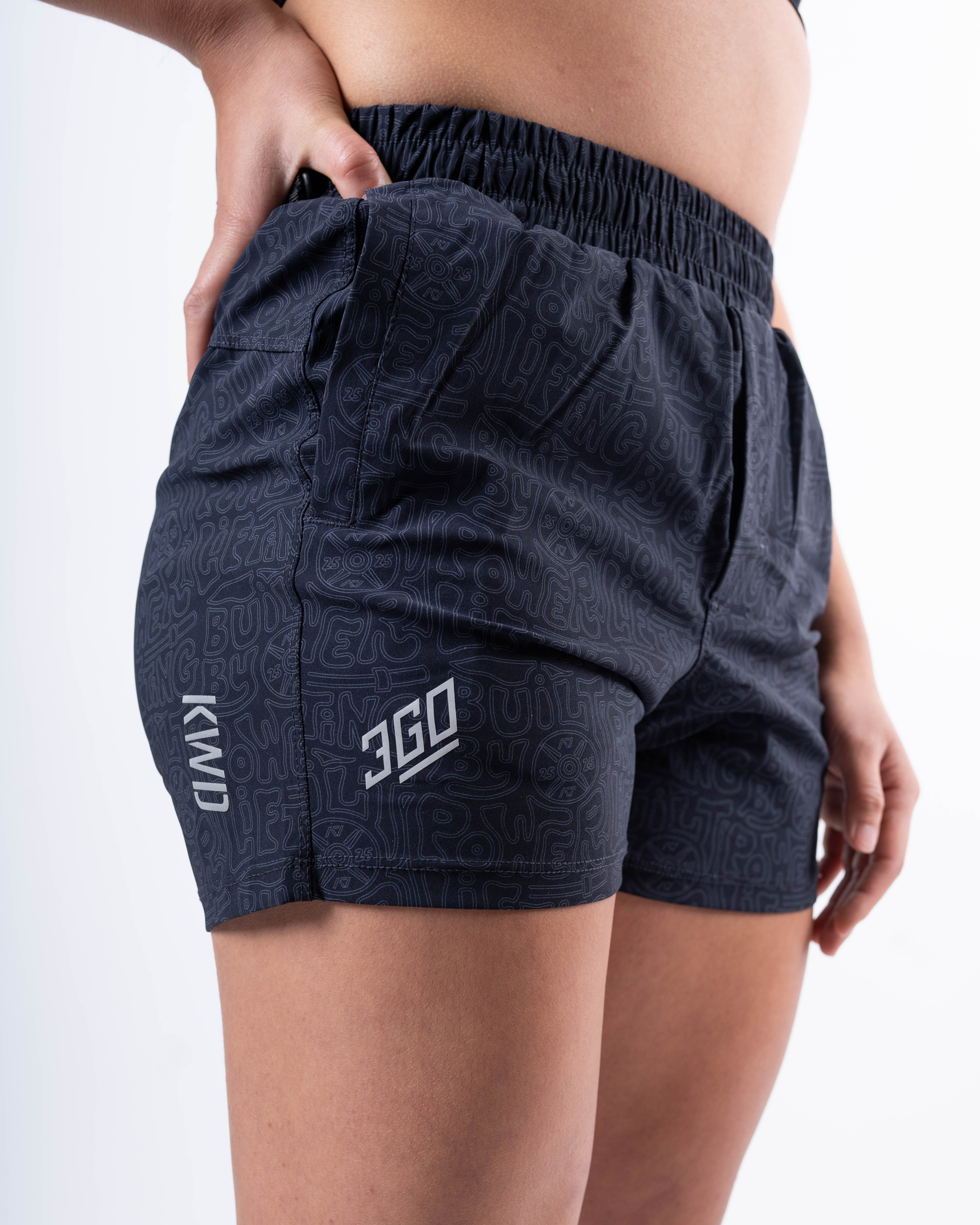 Detailed view of the matte silicone A7 logos and Built By Powerlifting design on the A7 360Go 1Z KWD Shorts in Stealth/Shadow.