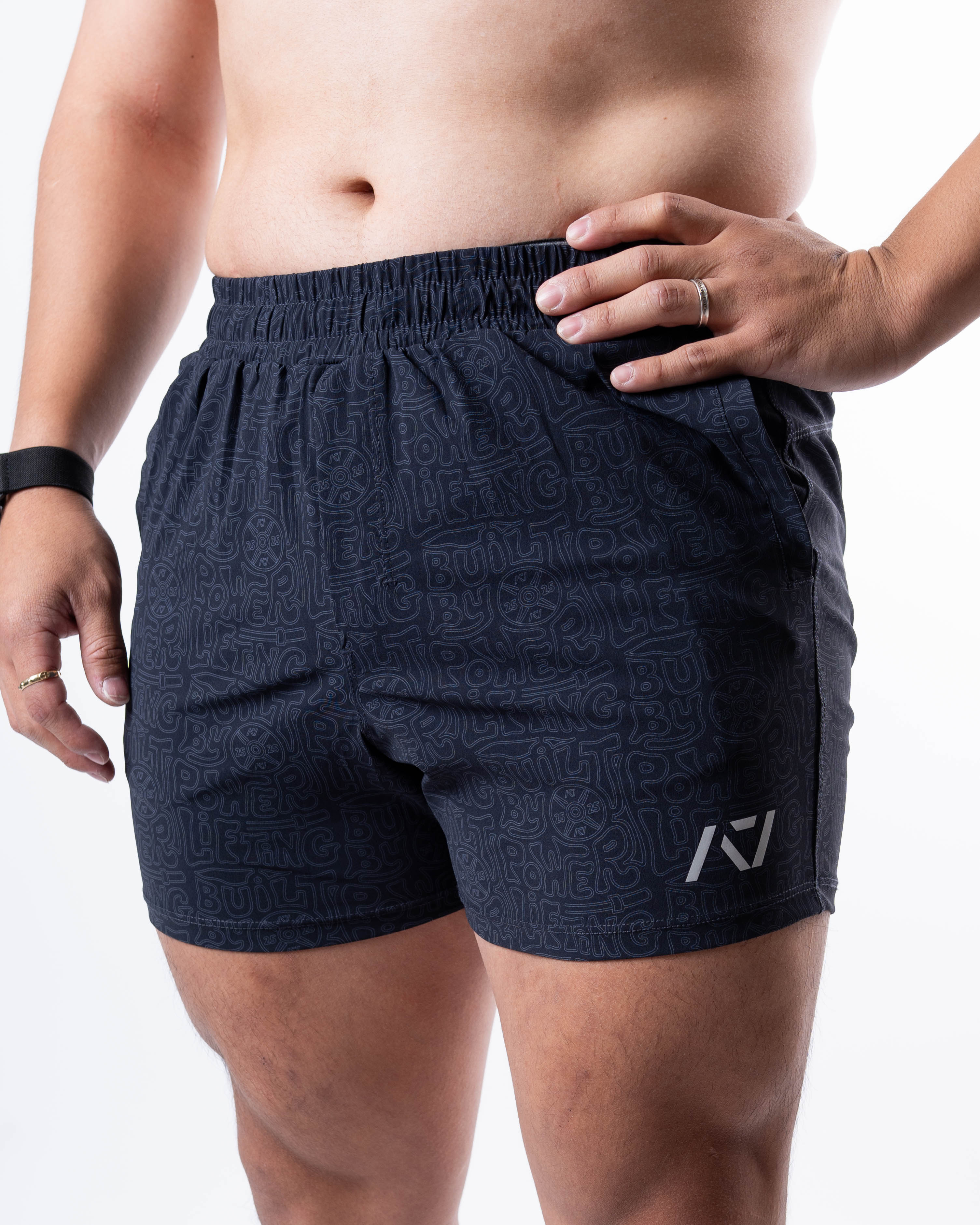 Front view of A7 360Go 1Z KWD Shorts in Stealth/Shadow colorway, showcasing matte silicone A7 logo and Built By Powerlifting design.