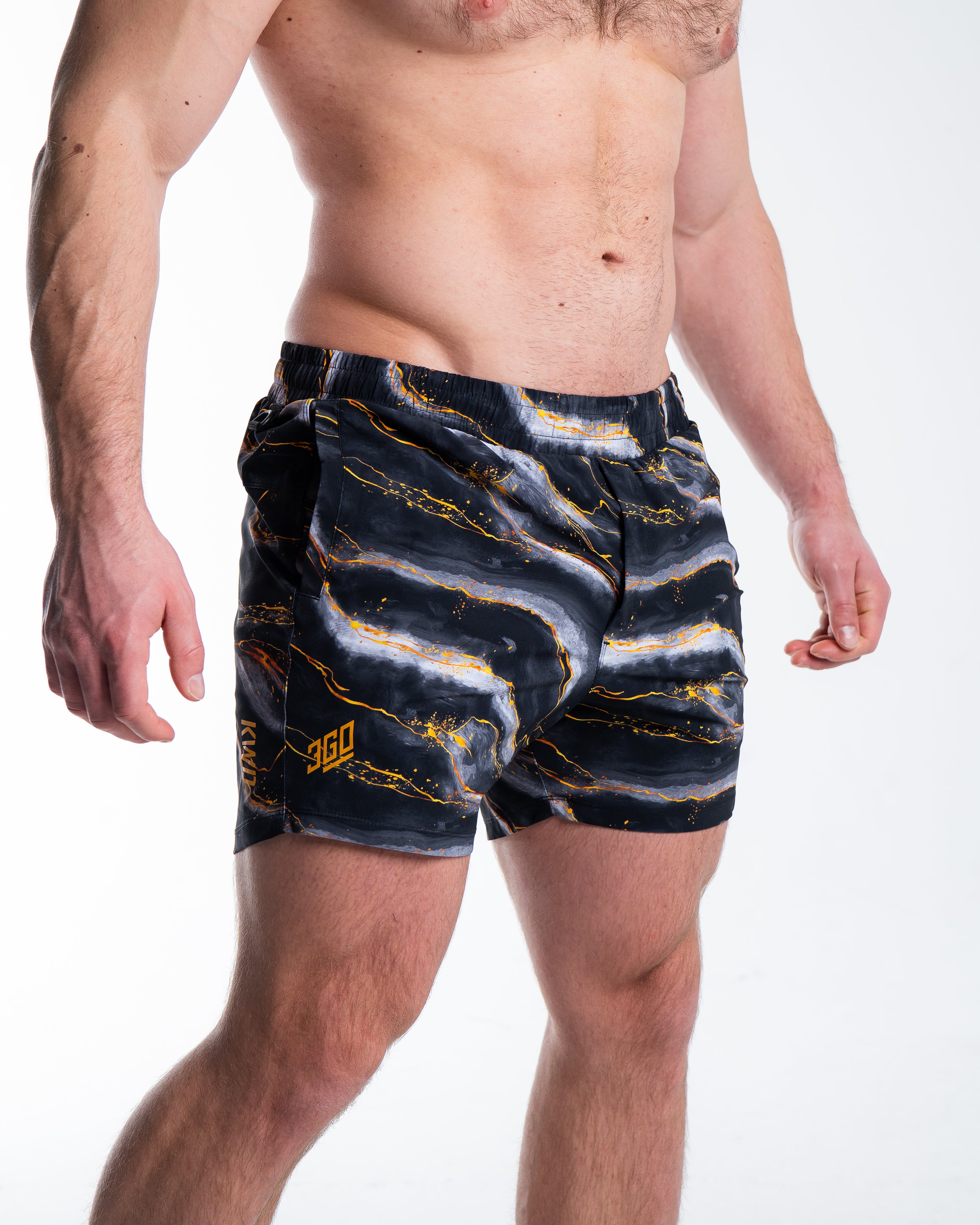 Front view of A7 360Go 1Z KWD Shorts – Aurum in gold colorway with matte silicone logo