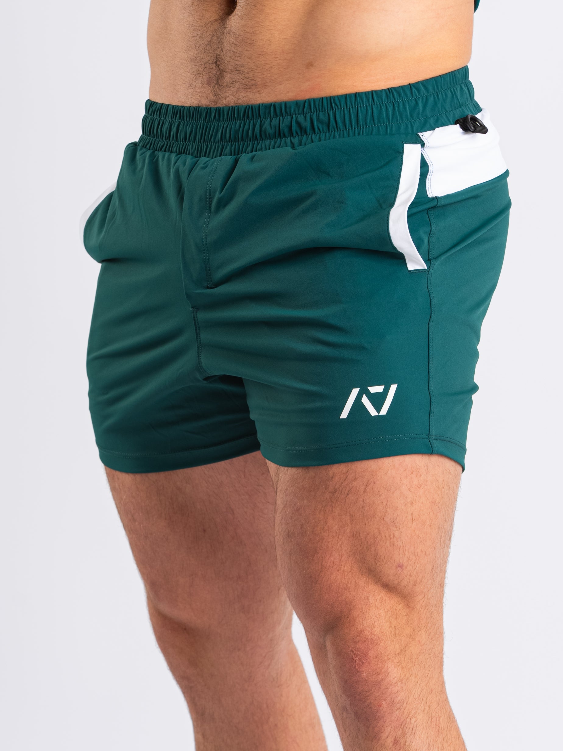 Front view of A7 360Go 1Z KWD Shorts in Emerald Forás, showing built-in liner and matte A7 silicone branding