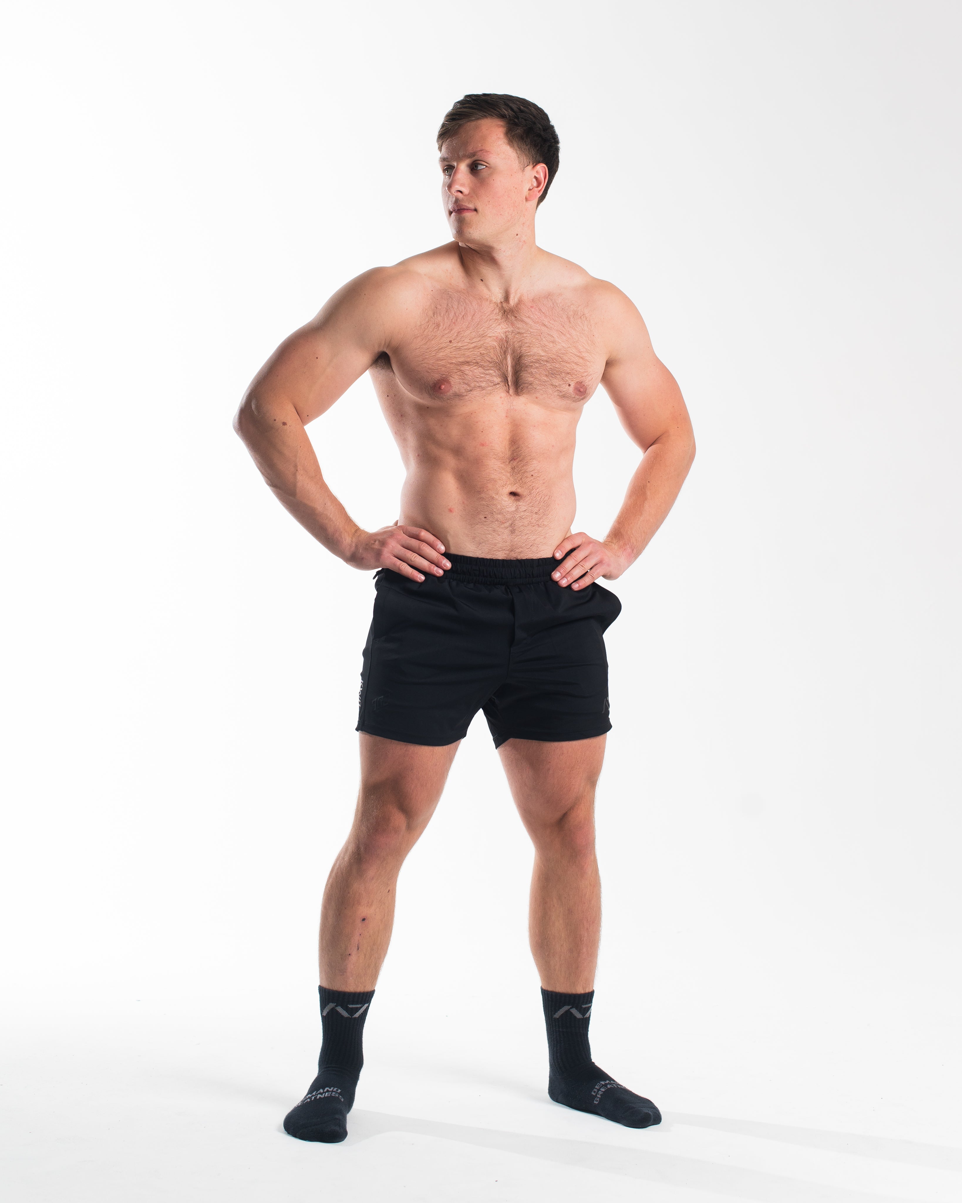 Full body shot of athlete wearing A7 360Go 1Z KWD Shorts in Stealth, showcasing fit, style, and performance-ready look.