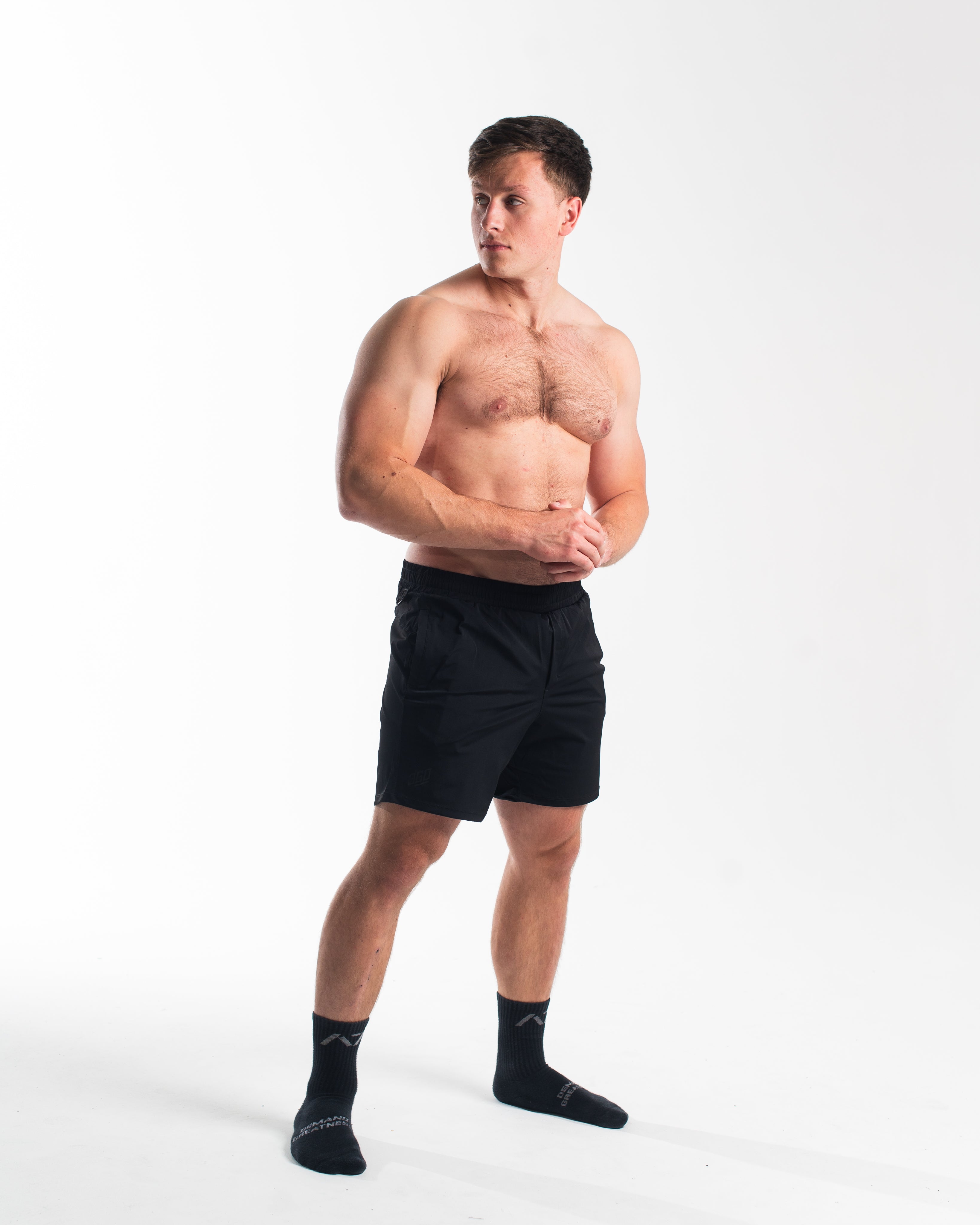 Full body image of athlete wearing A7 360Go 1Z Shorts in Stealth, highlighting overall fit and performance design.