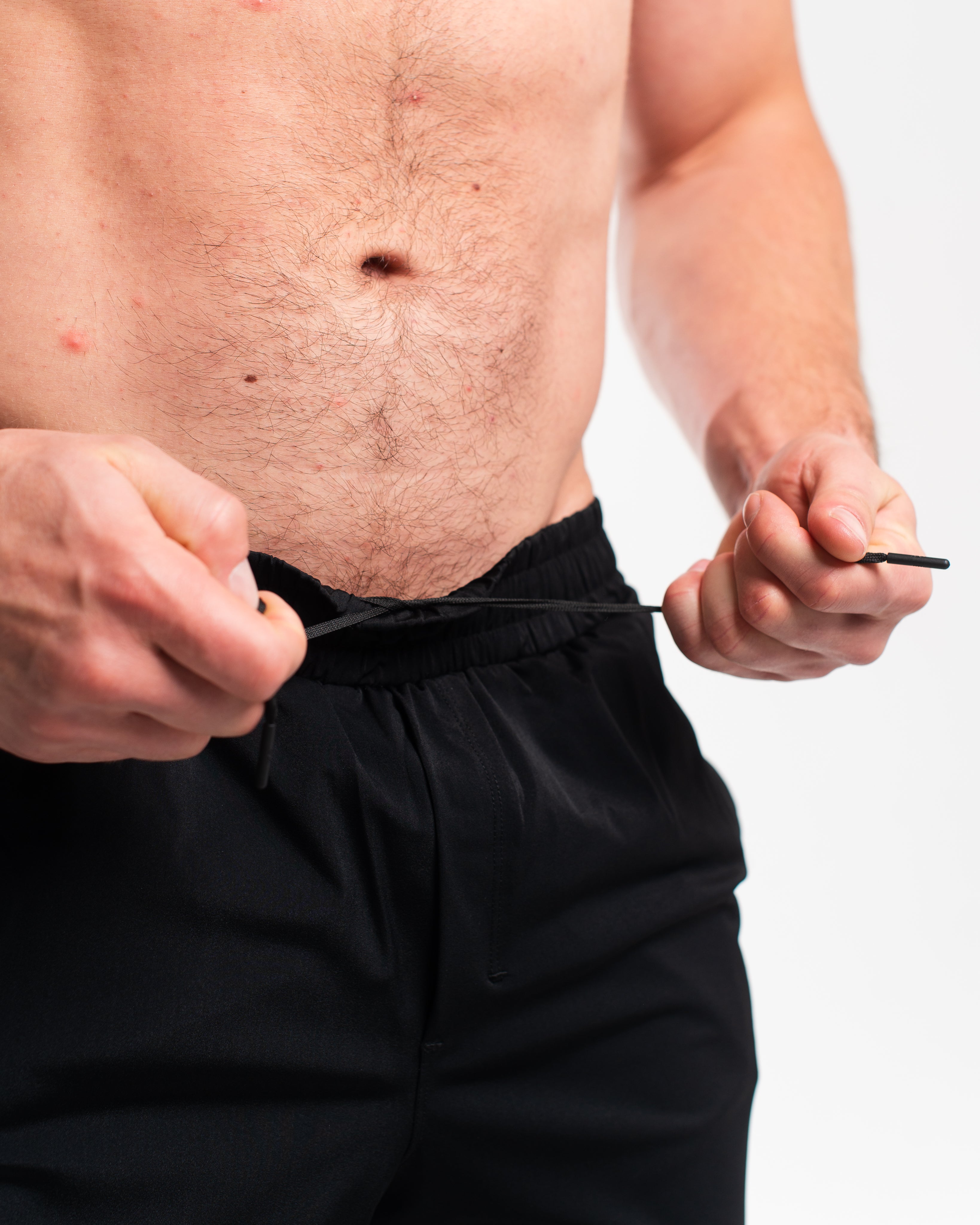 Wide waistband with adjustable drawstrings and A7-branded aglets for a secure fit on 360Go 1Z Stealth Shorts.