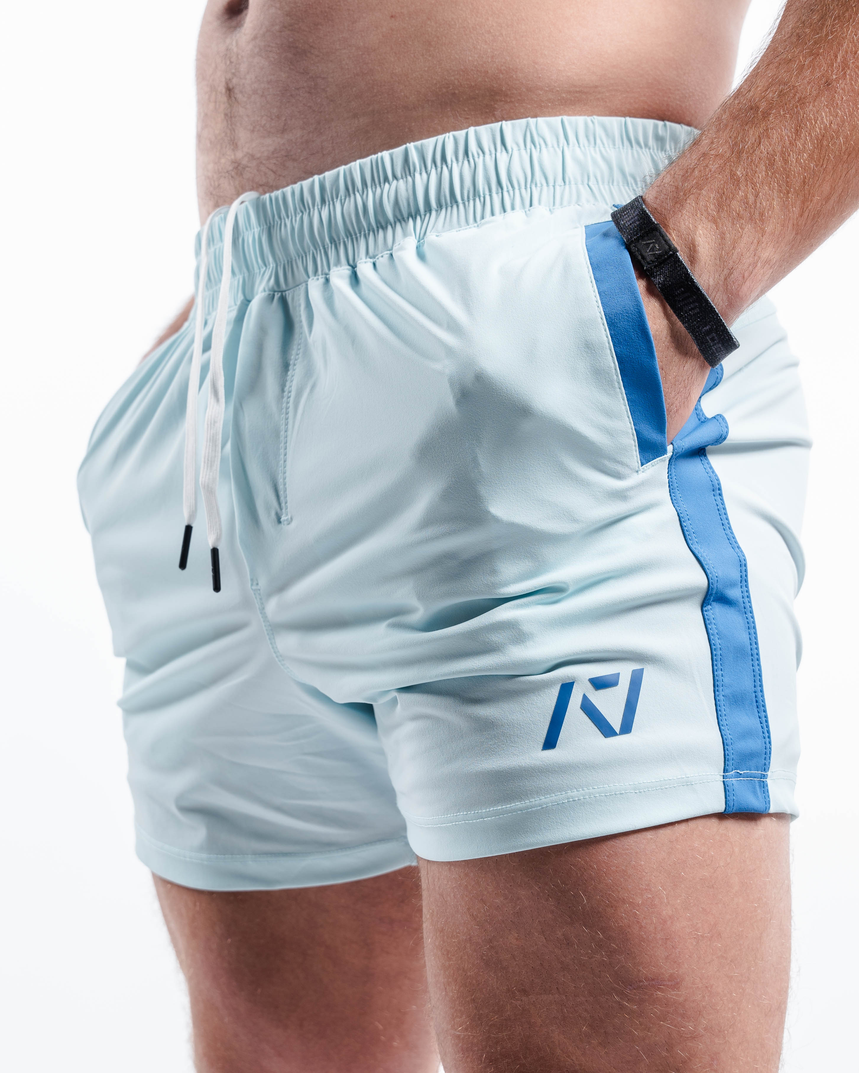 Side profile of Cyanite 360Go KWD Shorts featuring shorter inseam, flexible fit, and tapered cut.