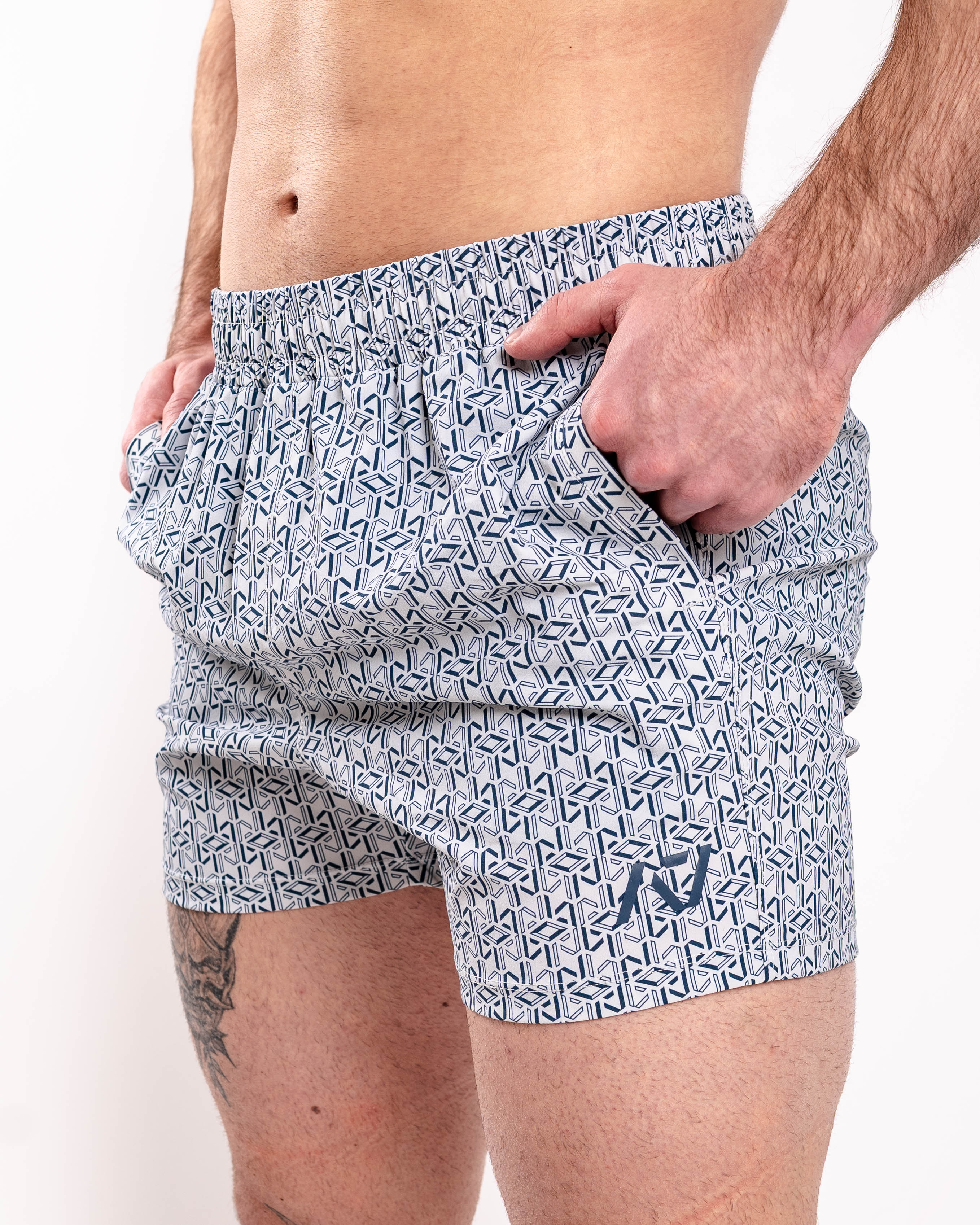 Front view of A7 360Go KWD Shorts in Stelacrosha Tides, featuring deep gray-black tones, wide waistband, and performance fit.