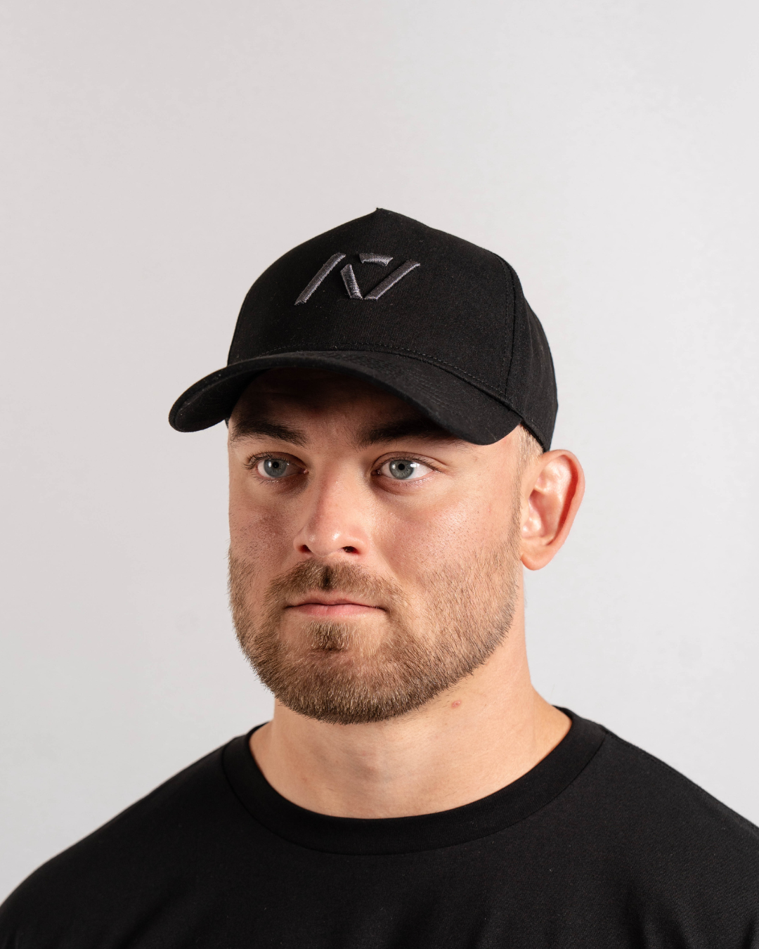 Front view of A7 5 Panel Snapback Hat in Shadow Stone featuring structured panel and woven A7 logo patch.