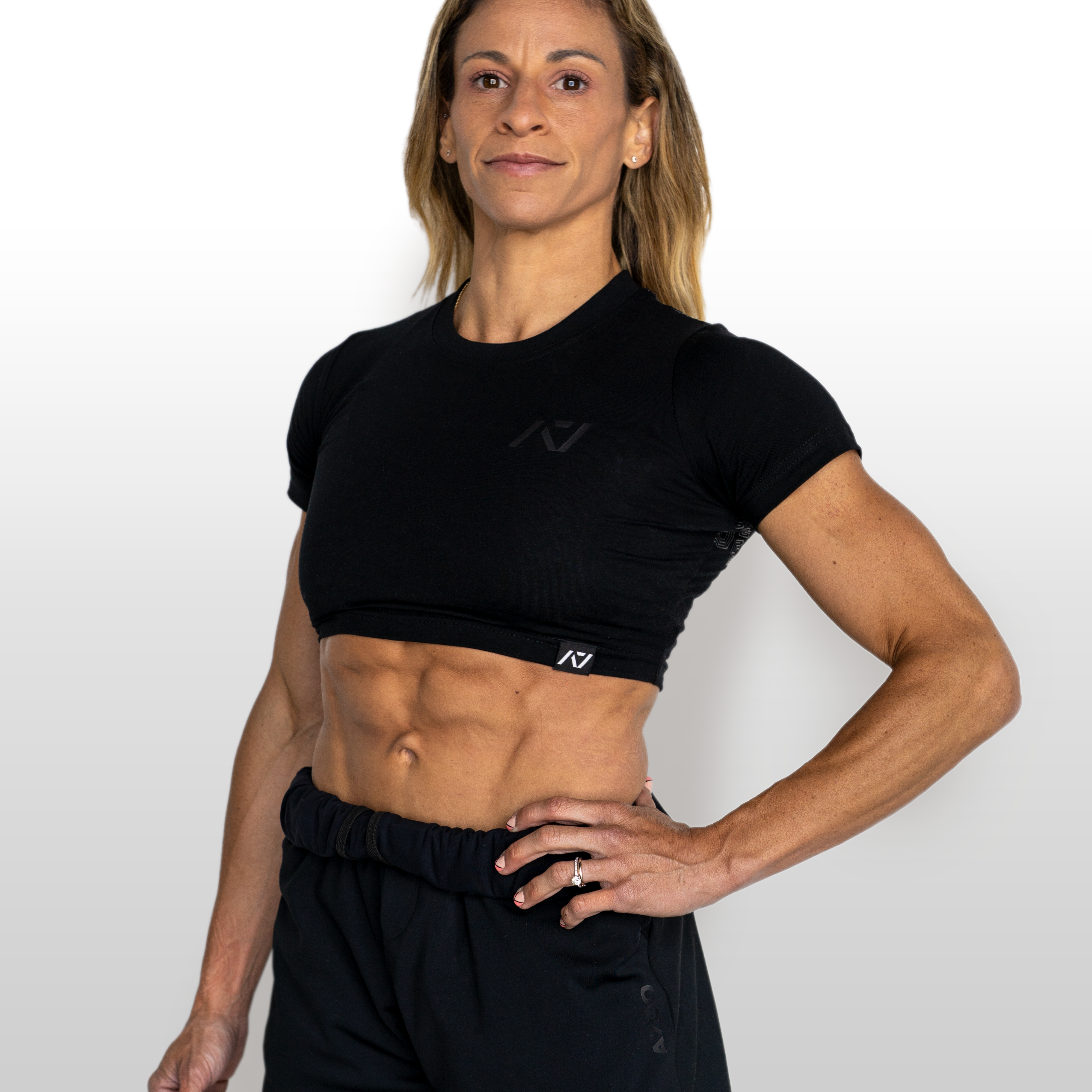 Person wearing a black athletic outfit on a white background