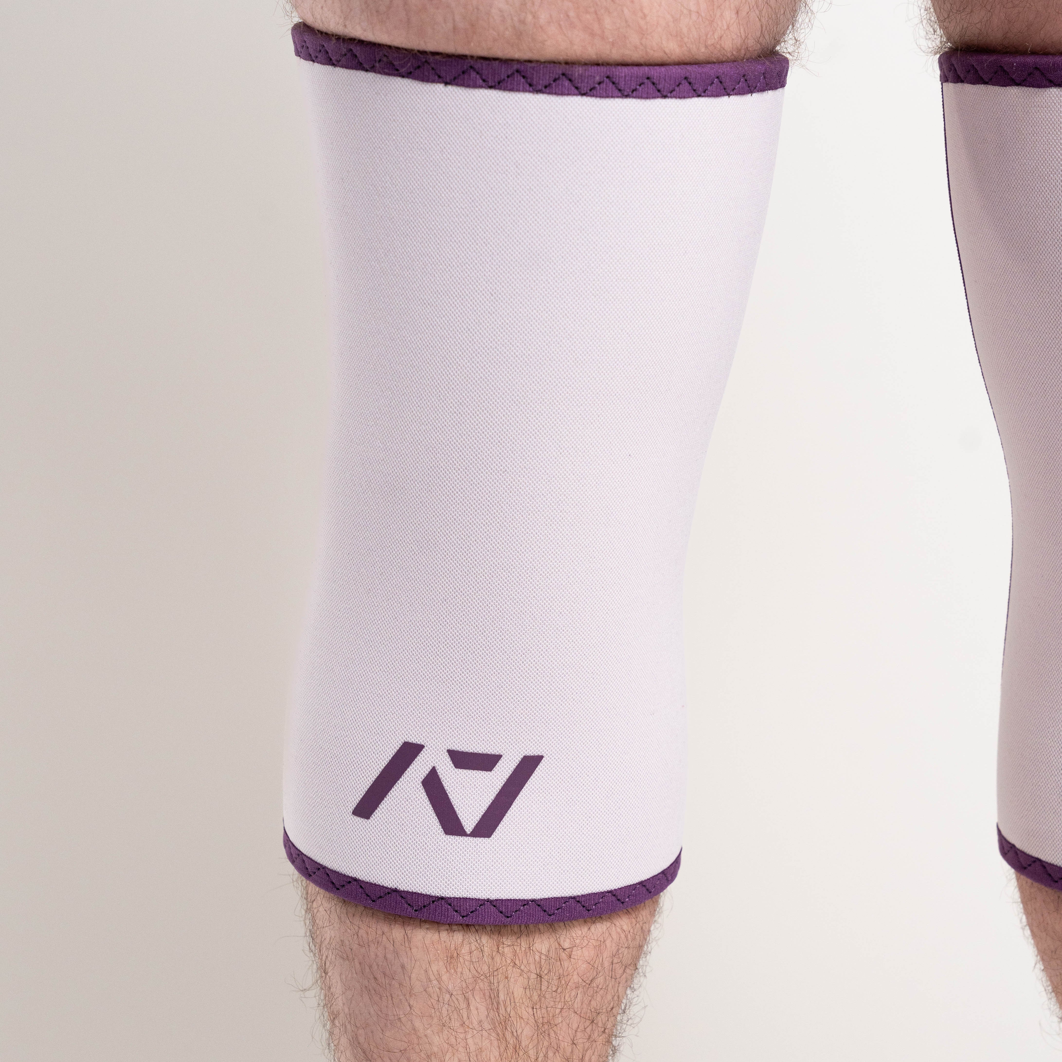 Close up of A7 Logo and colours on Hourglass Knee Sleeves in Lavender