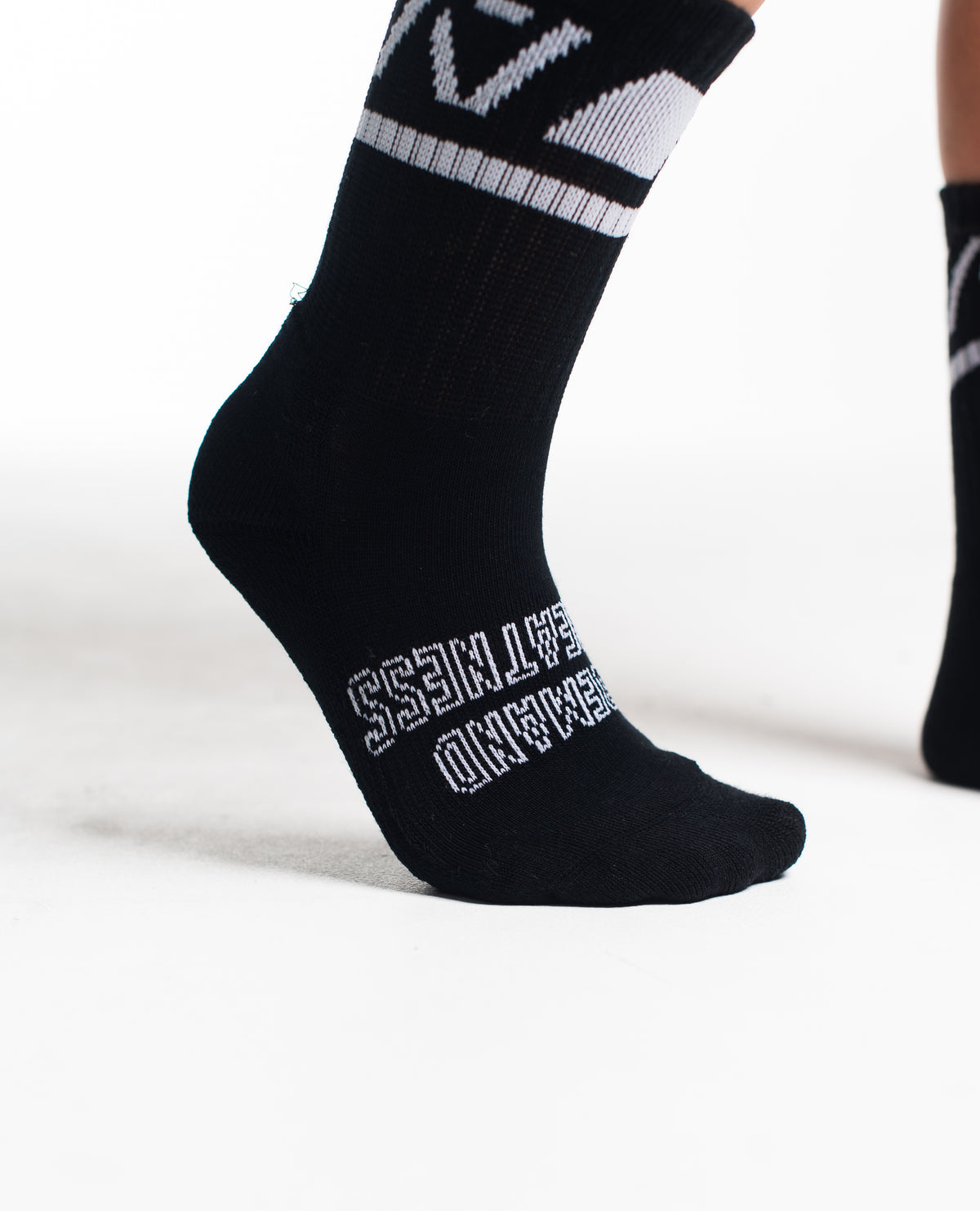 Close-up of the knit fabric on A7 Crew Socks in Black Domino, showing texture and stitching details.