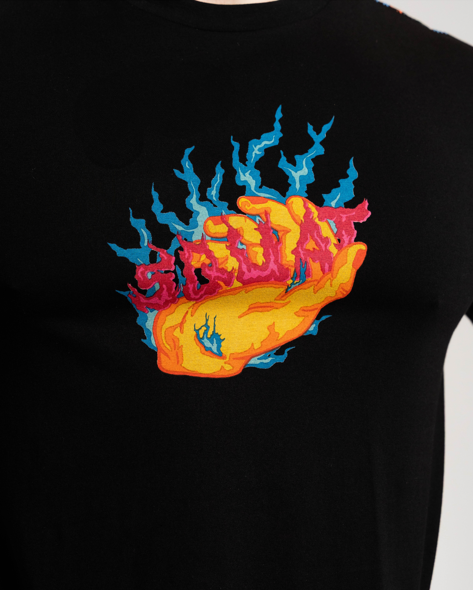 Black t-shirt with a colorful graphic design on a white background