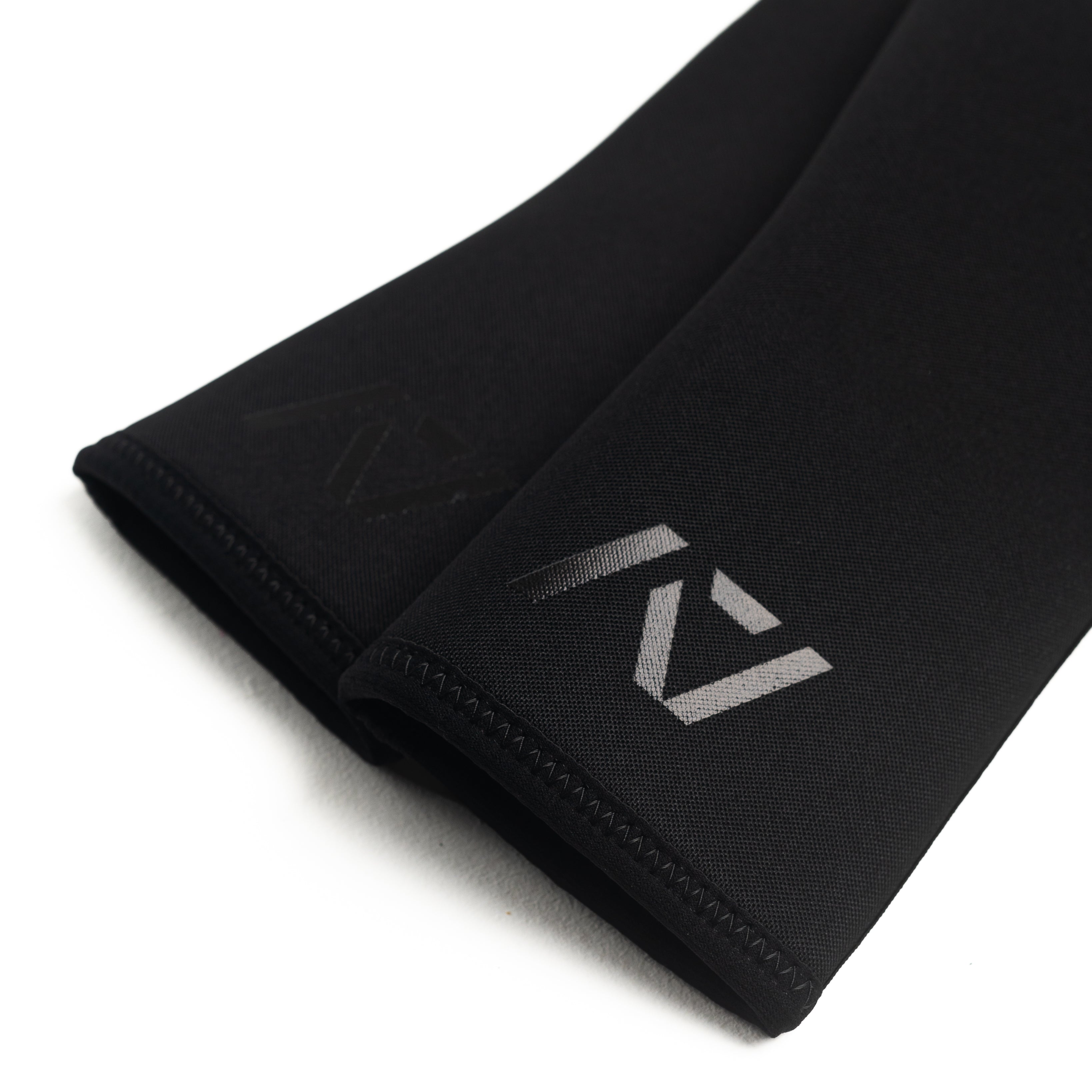 Flat lay of A7 Hourglass Knee Sleeves - showing knee sleeve stitching and A7 logo
