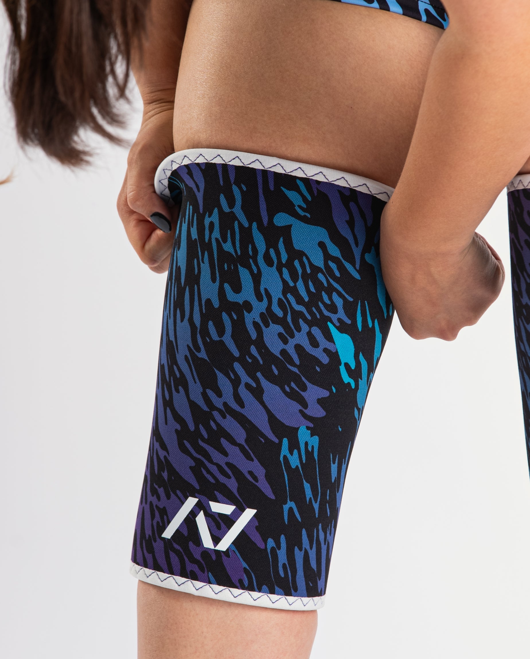 Close-up of A7 Hourglass Knee Sleeves – Rigor Mortis – Violet Tiger, displaying double-stitched seams and tiger print design.