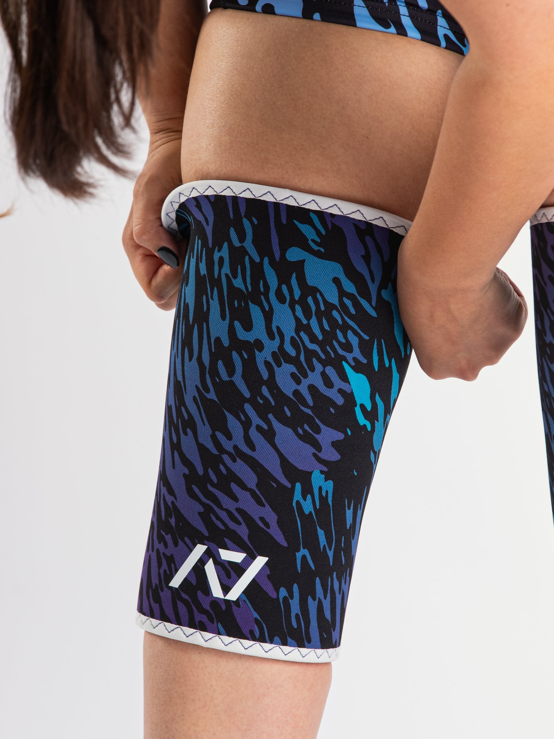 Close-up of A7 Hourglass Knee Sleeves – Rigor Mortis – Violet Tiger, displaying double-stitched seams and tiger print design.