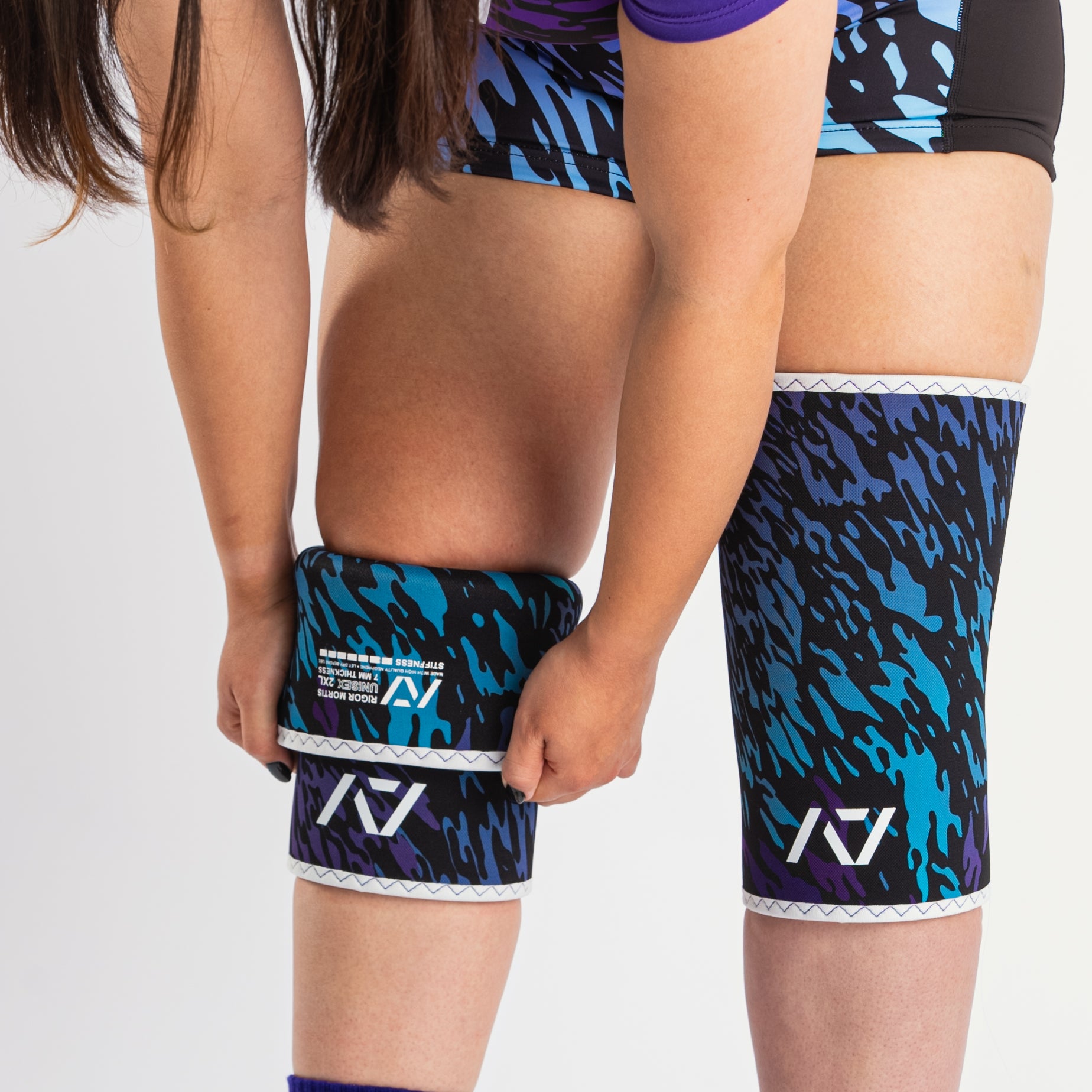 Full front view of the hourglass-shaped taper on A7 Knee Sleeves – Rigor Mortis – Violet Tiger, emphasizing targeted knee joint compression for powerlifting.