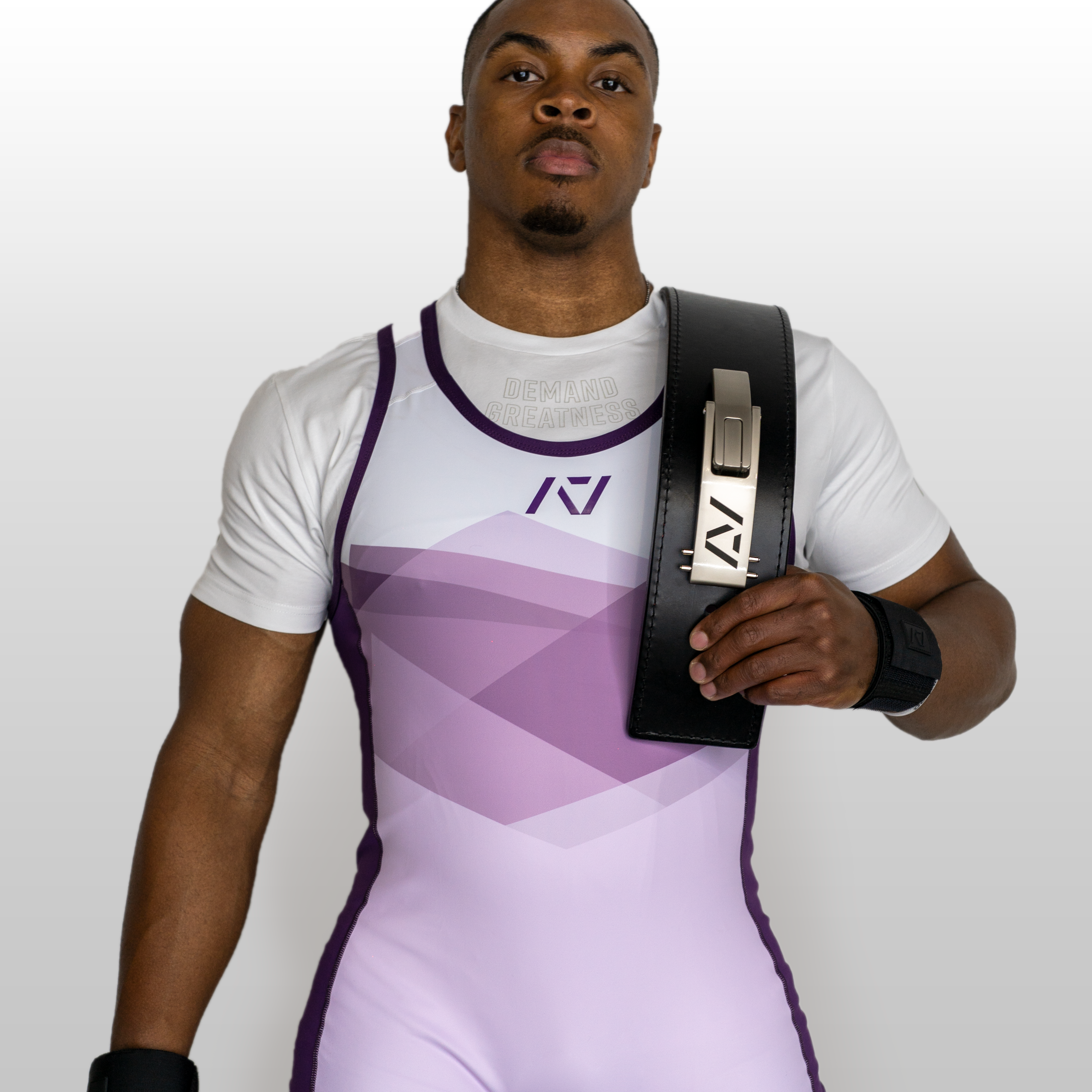 Front shot of male model wearing rausch men's singlet in lavender showcasing shit and compression