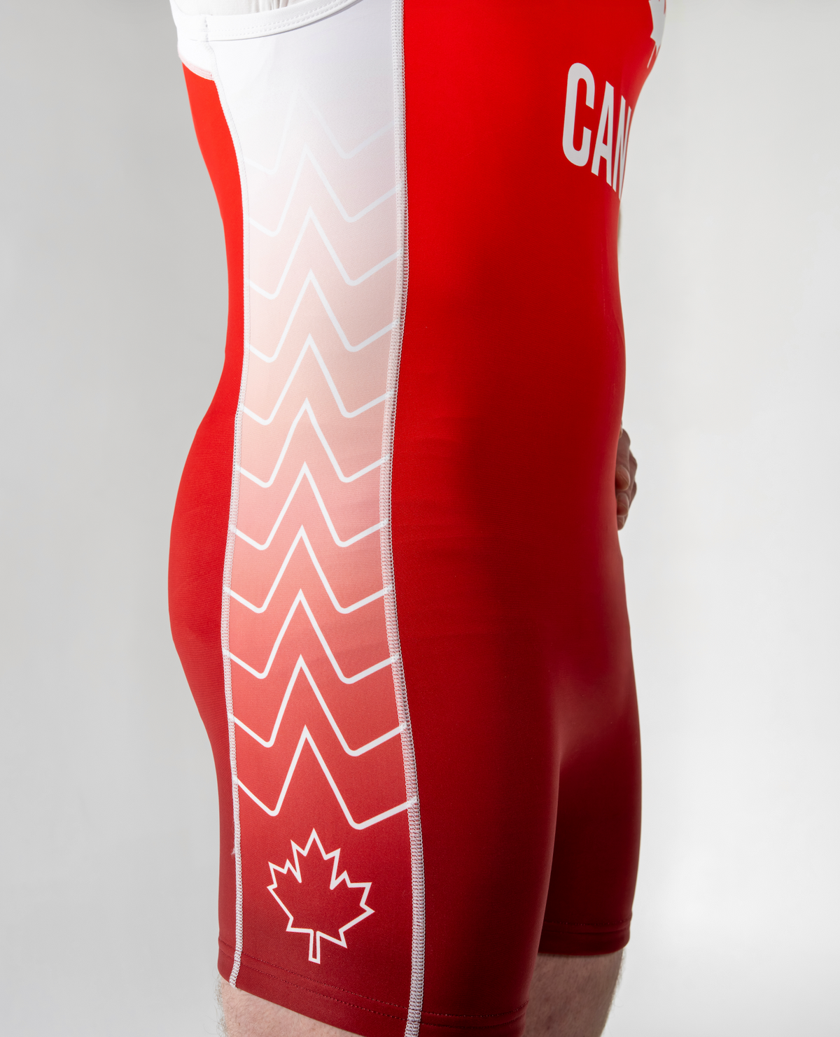 Red singlet with white patterns and 'Canada' text on a plain background