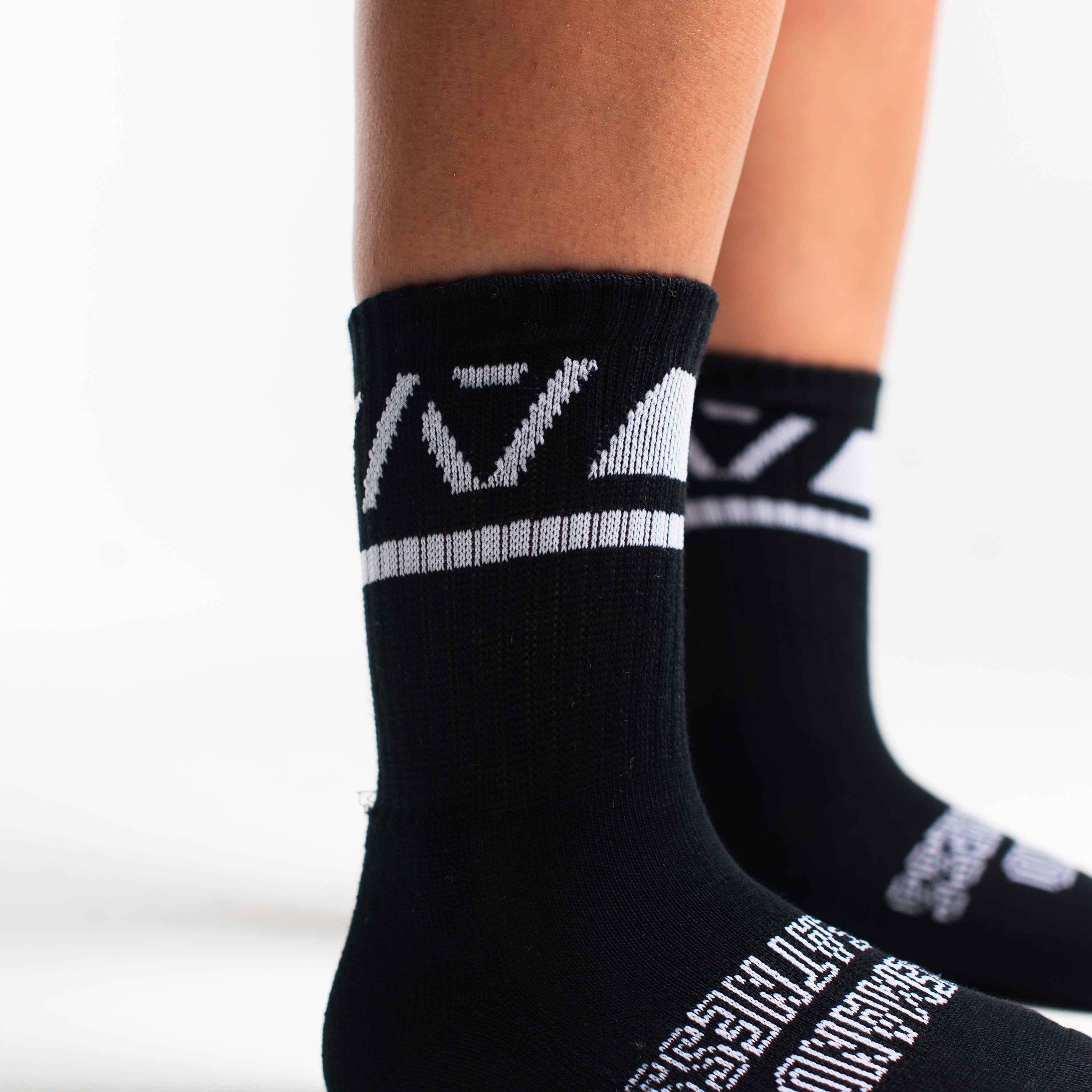 Close-up of the knit fabric on A7 Crew Socks in Black Domino, showing texture and stitching details.