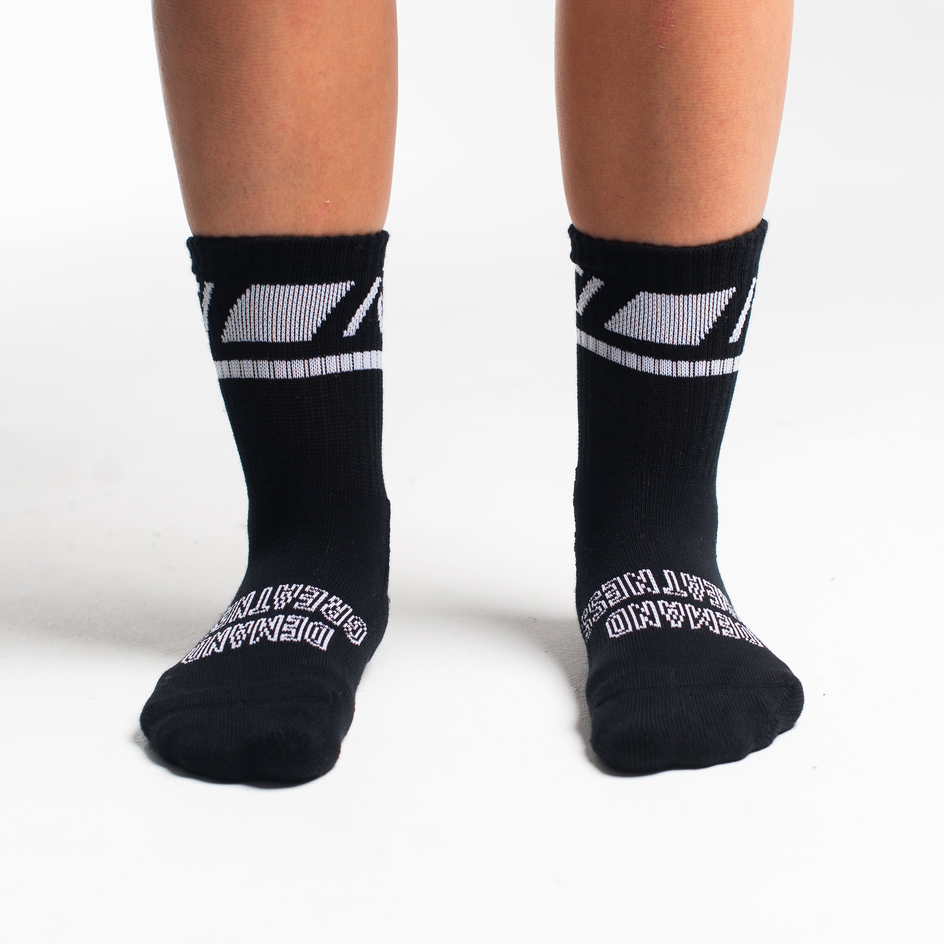 Front view of A7 Crew Socks in Black Domino, showcasing mid-shin length and ribbed cuff design.