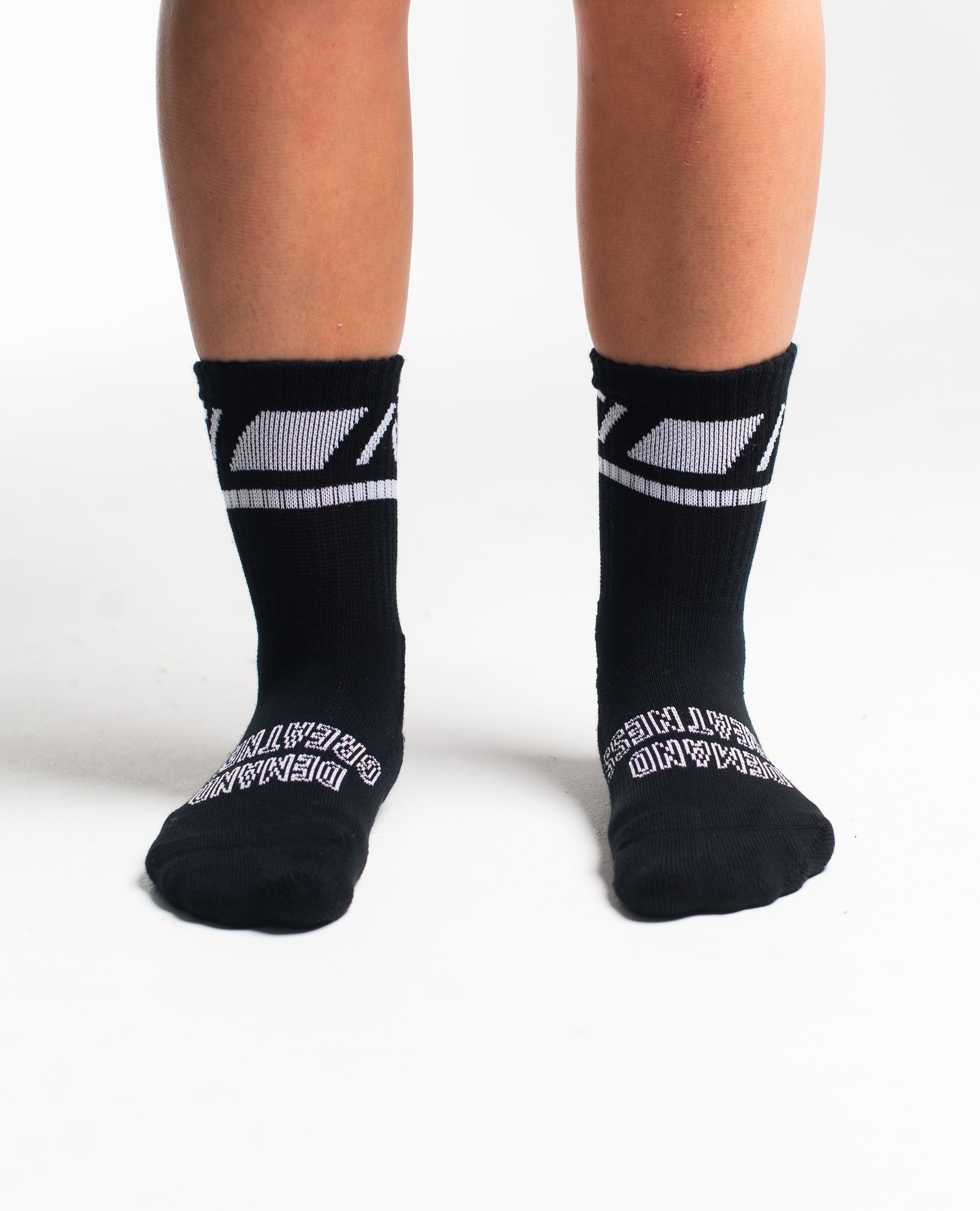 Front view of A7 Crew Socks in Black Domino, showcasing mid-shin length and ribbed cuff design.