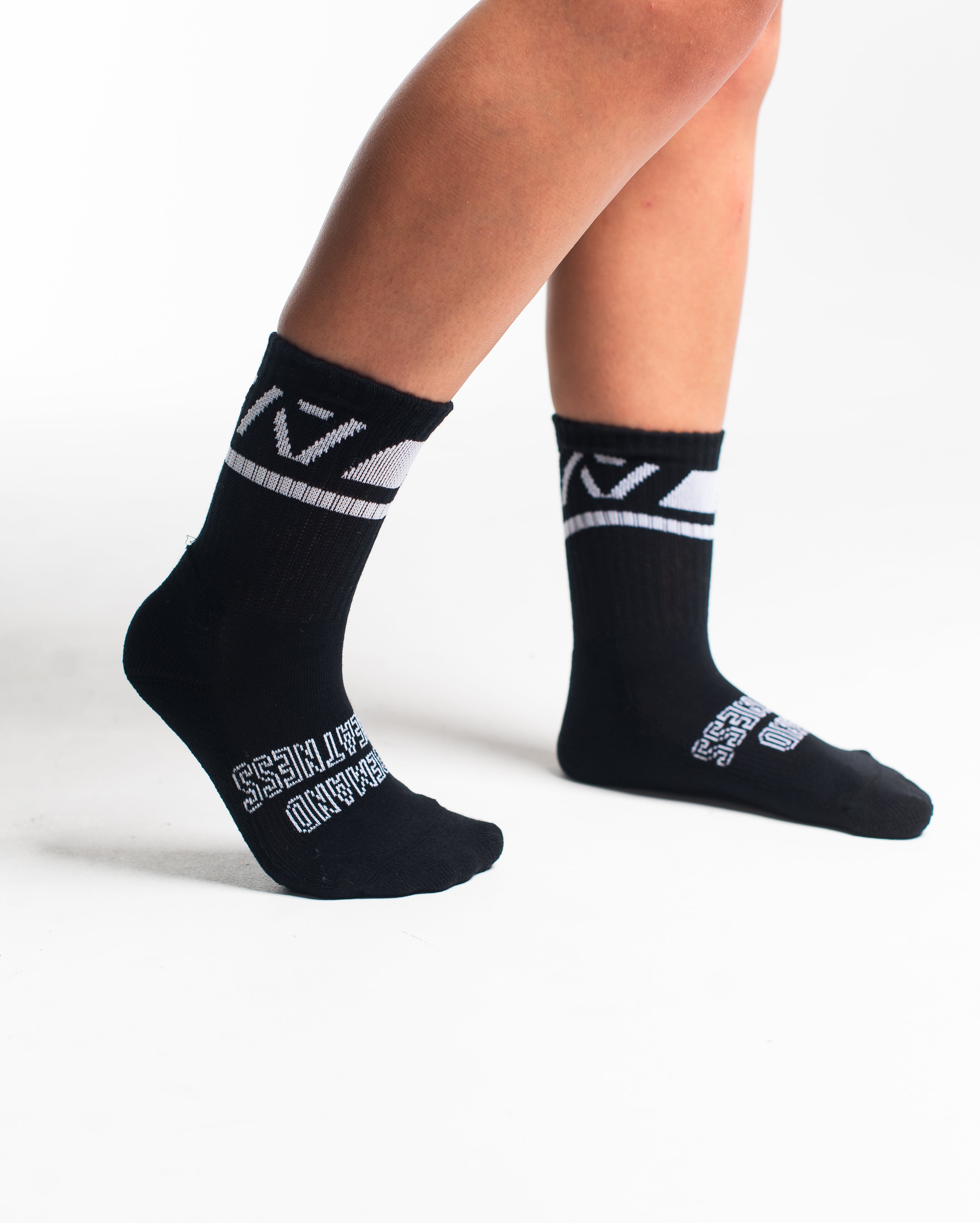 Side profile of A7 Crew Socks in Black Domino, highlighting the A7 logo on the ankle and compression-style top