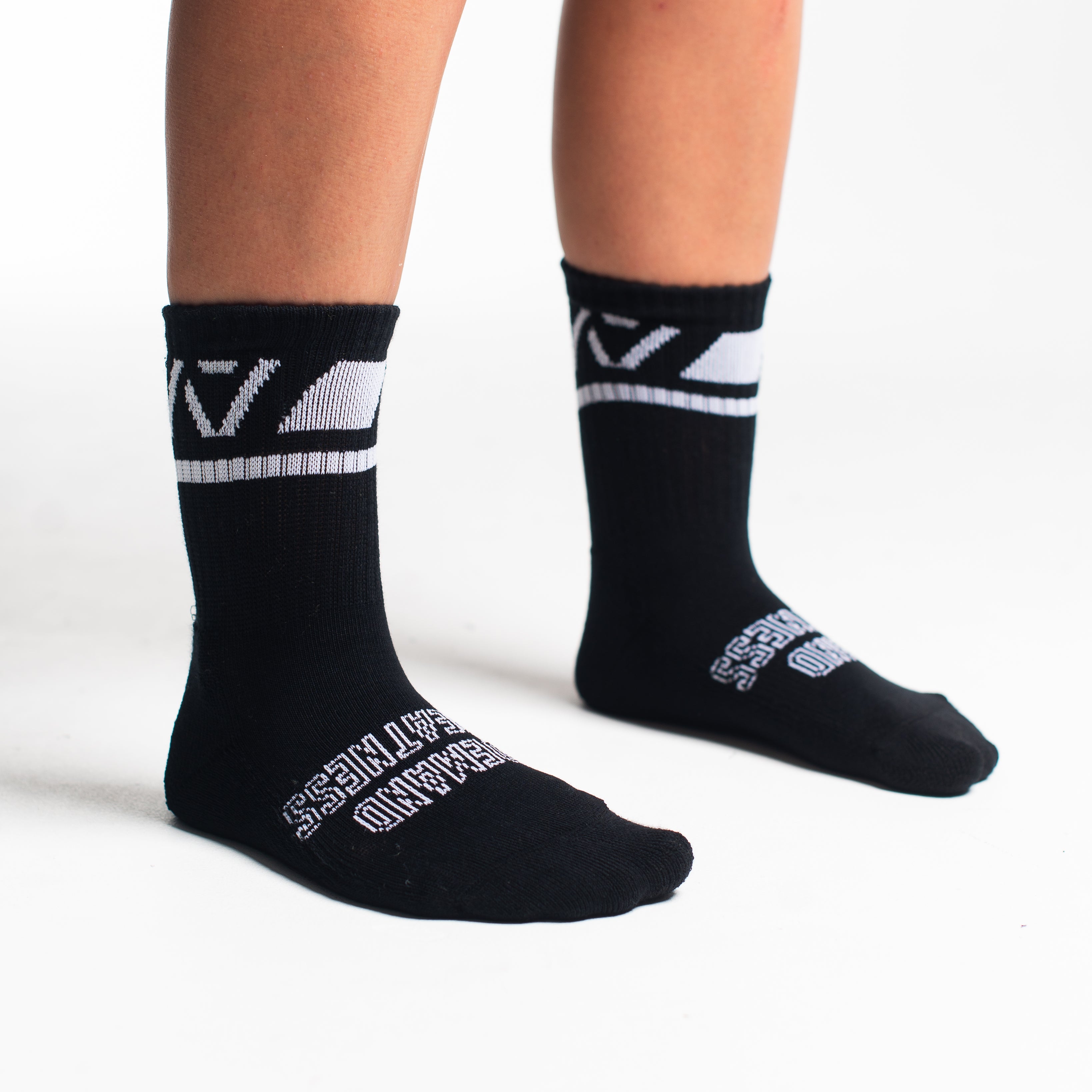 Side profile of A7 Crew Socks in Black Domino, highlighting the A7 logo on the ankle and compression-style top.