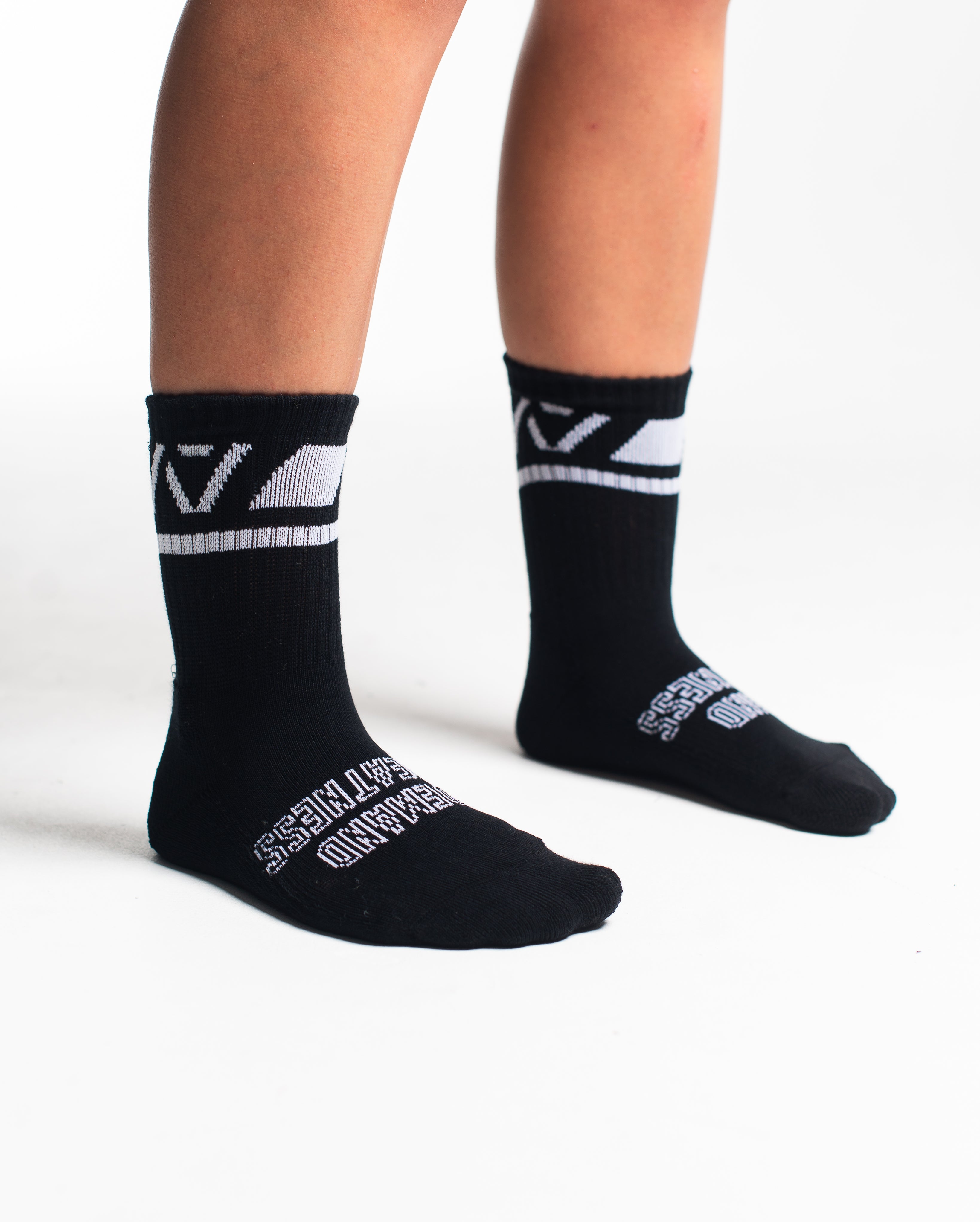 Side profile of A7 Crew Socks in Black Domino, highlighting the A7 logo on the ankle and compression-style top.