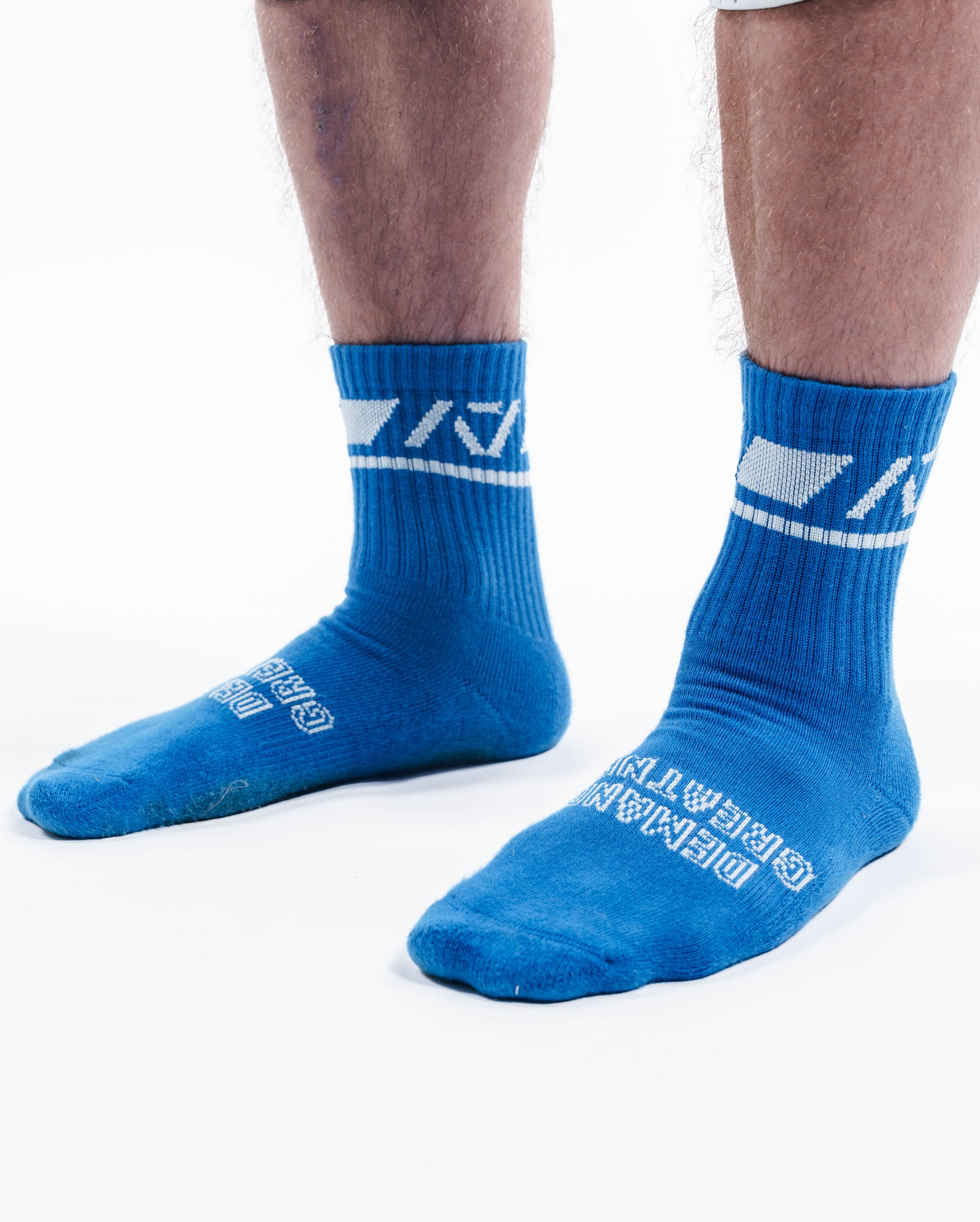 Close-up of knit fabric on A7 Crew Socks in Cyanite showing soft stretch texture and vibrant color contrast.