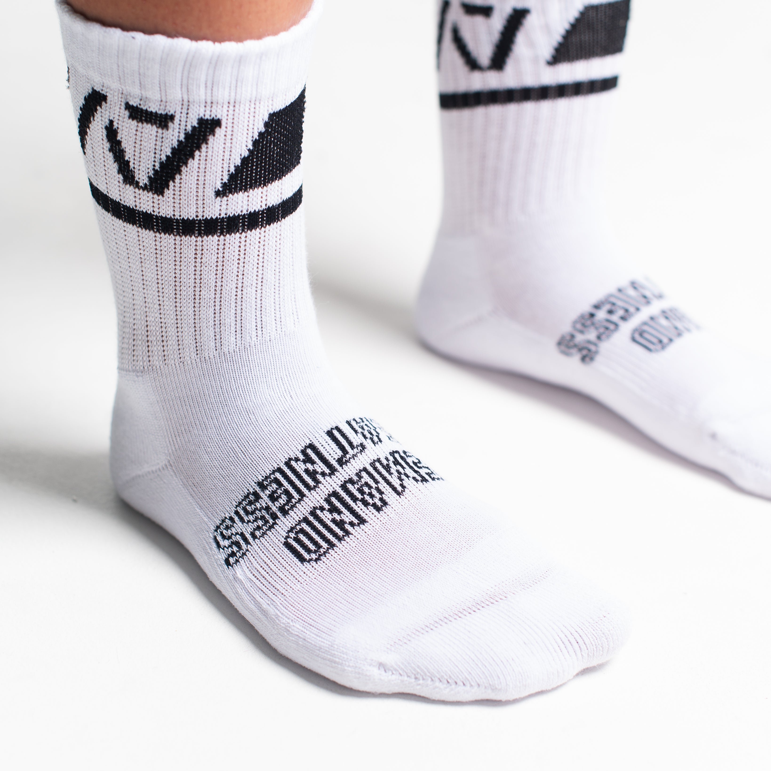 Close-up of the knit fabric on A7 Crew Socks in Domino White, showing texture and stitching details.
