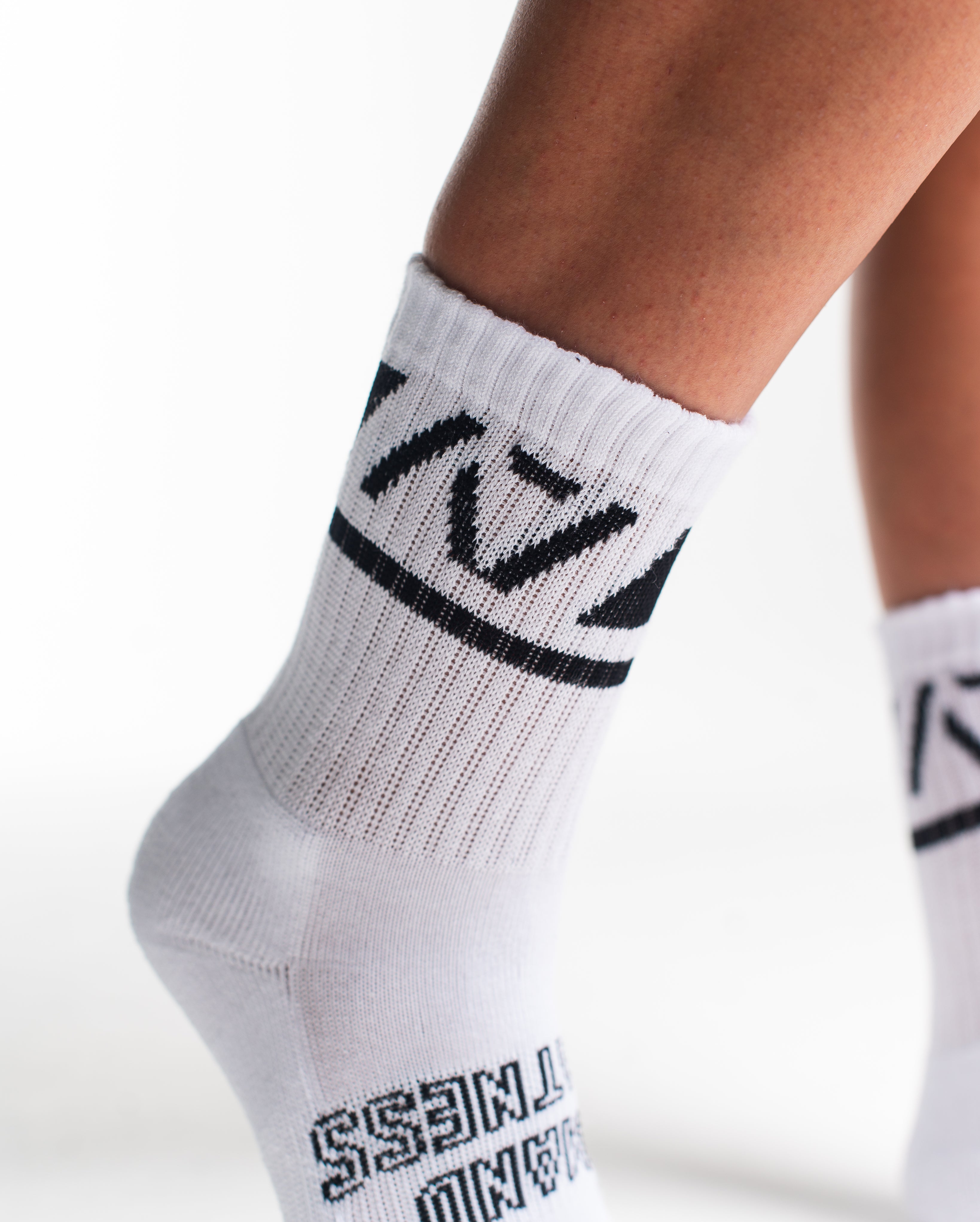 Close-up of the knit fabric on A7 Crew Socks in Domino White, showing texture and stitching details.