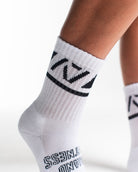 Close-up of the knit fabric on A7 Crew Socks in Domino White, showing texture and stitching details.