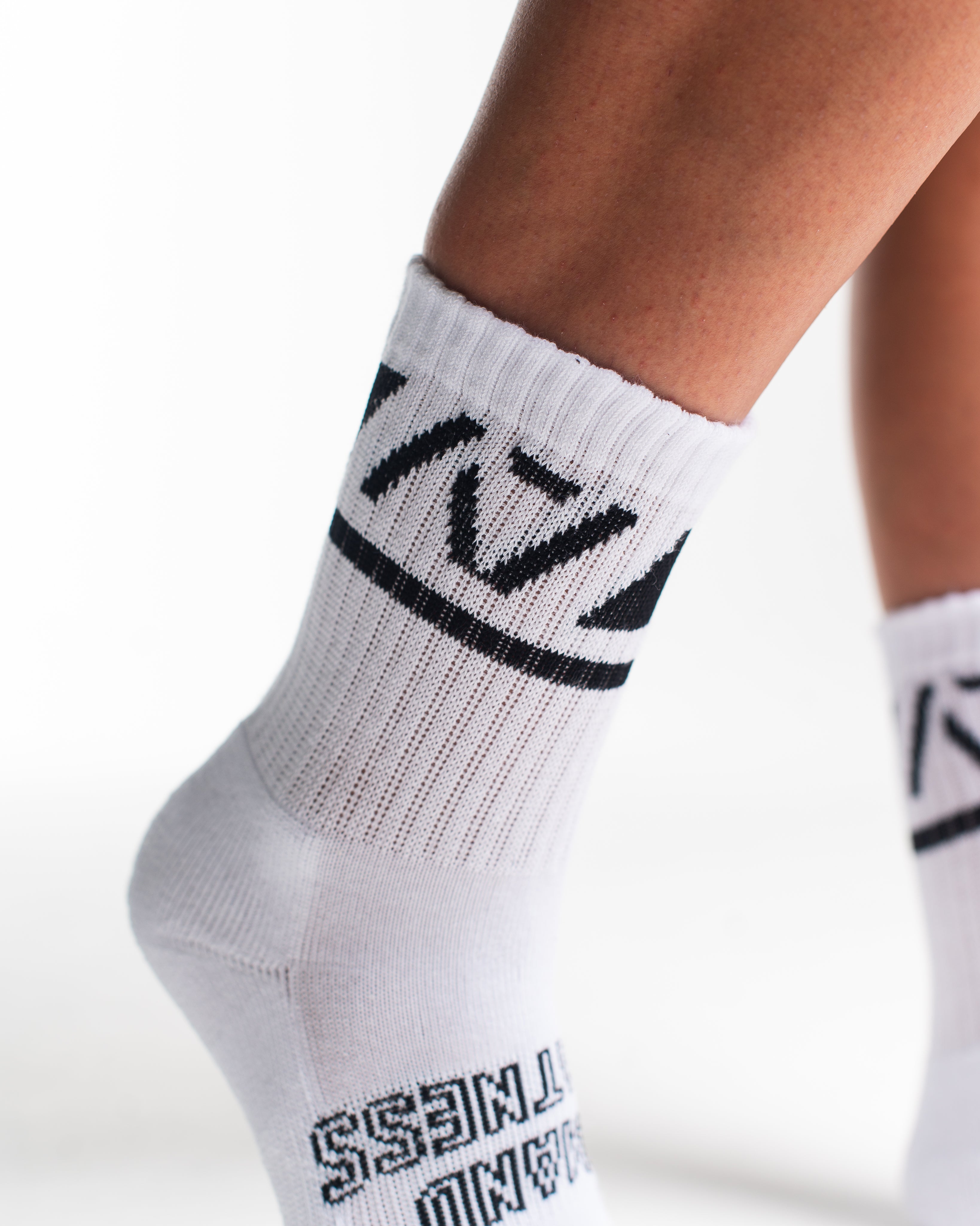 Close-up of the knit fabric on A7 Crew Socks in Domino White, showing texture and stitching details.
