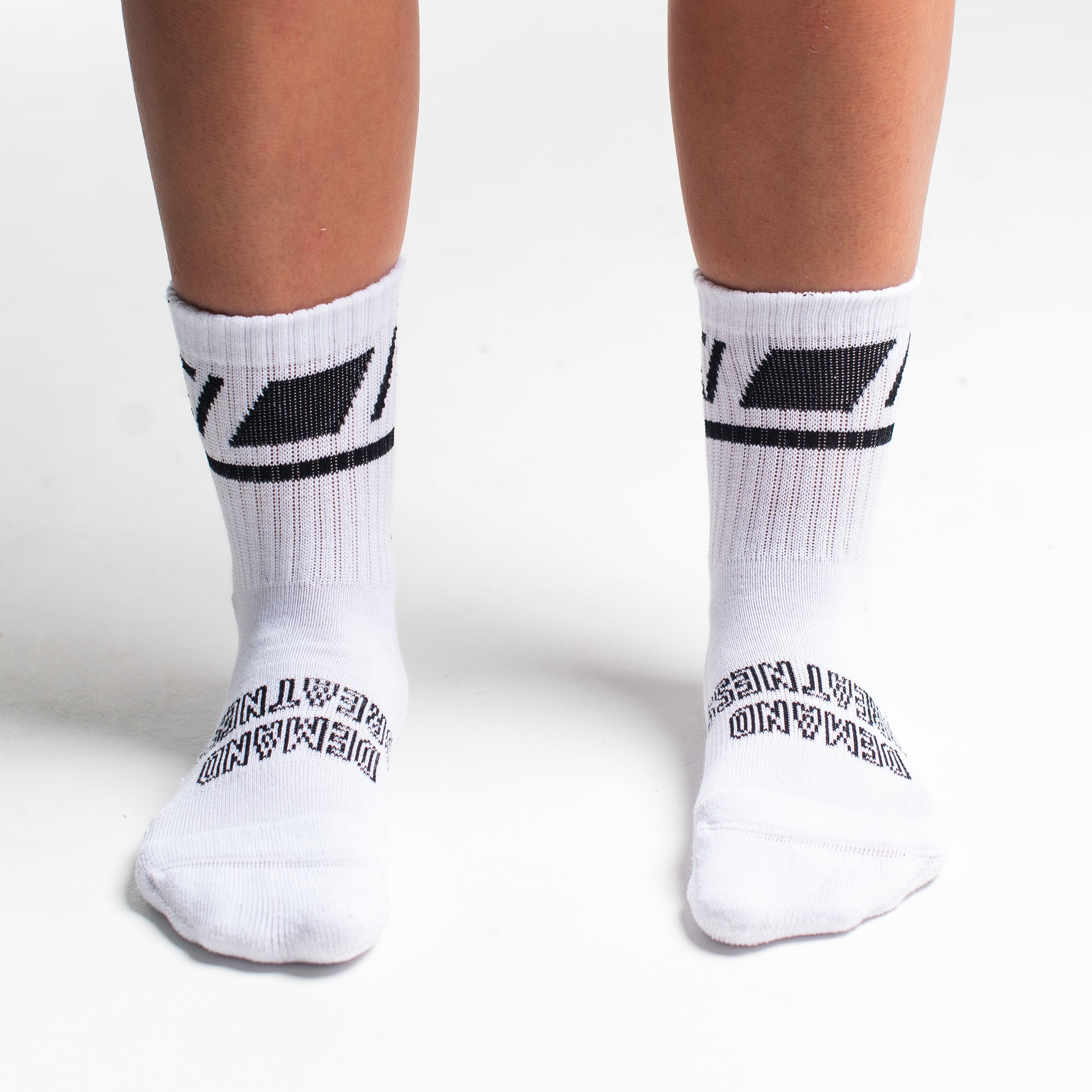 Front view of A7 Crew Socks in Domino White, showcasing mid-shin length and ribbed cuff design.