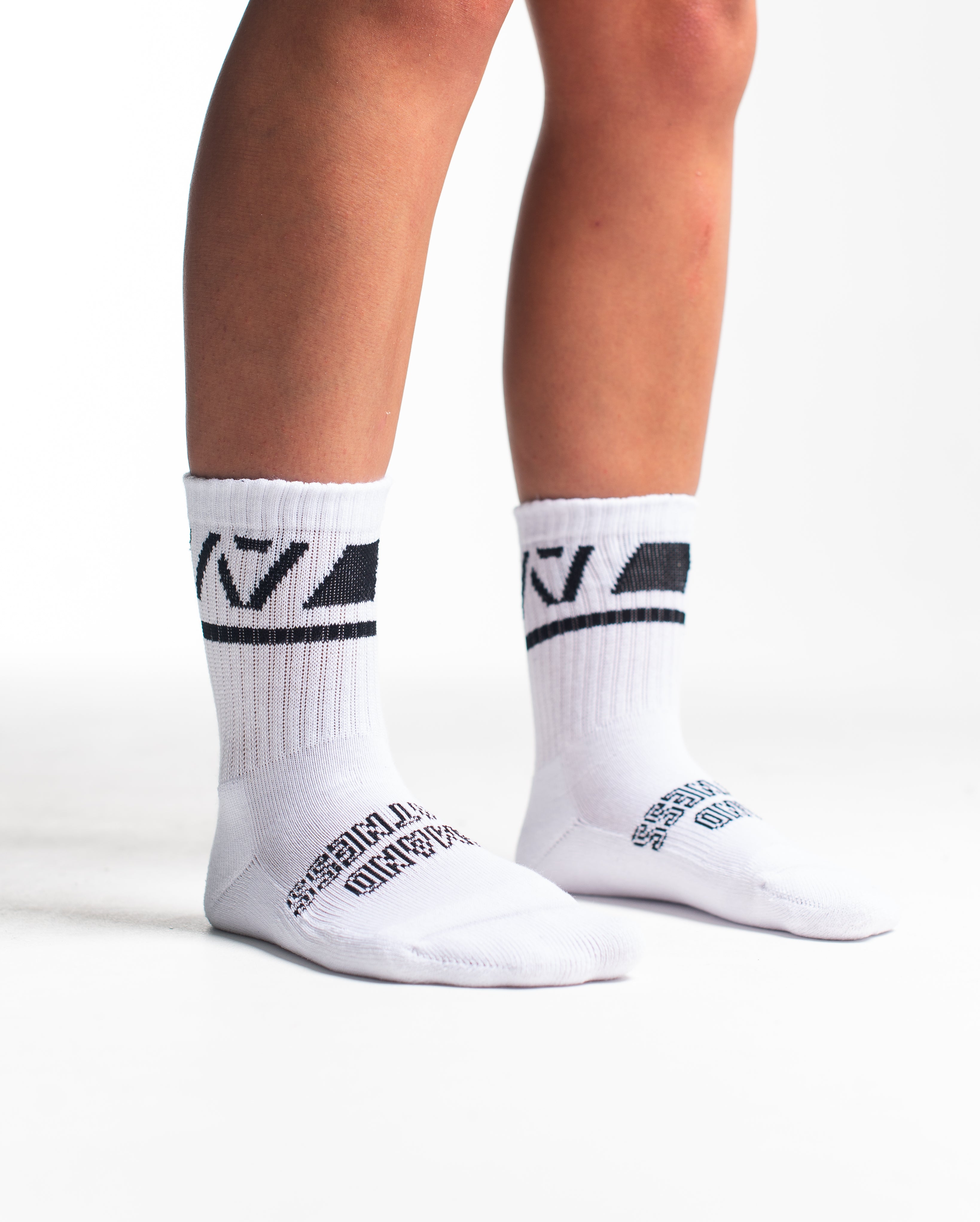 Side profile of A7 Crew Socks in Domino White, highlighting the A7 logo on the ankle and compression-style top.