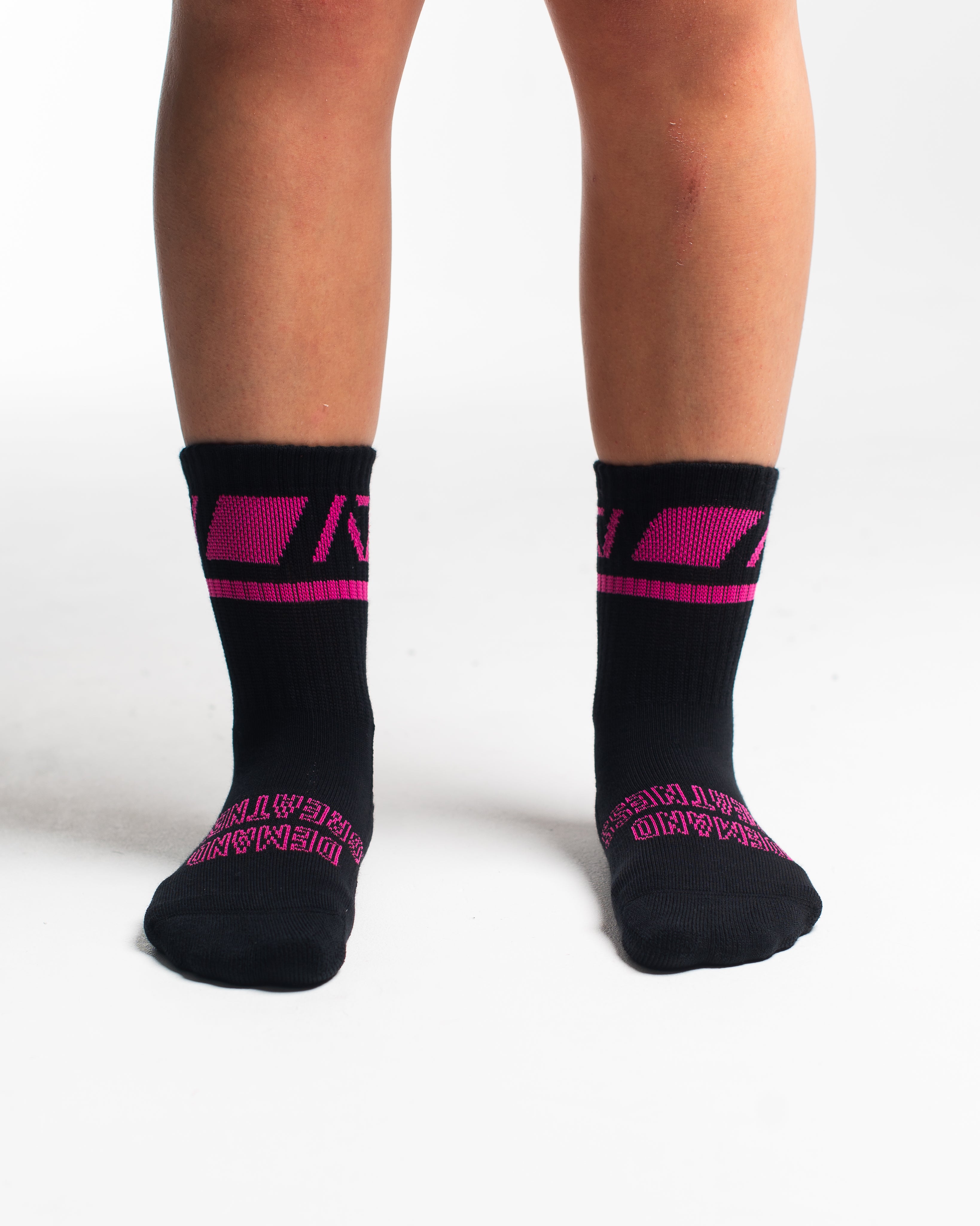 Front view of A7 Crew Socks in Flamingo, showcasing mid-shin length and ribbed cuff design.