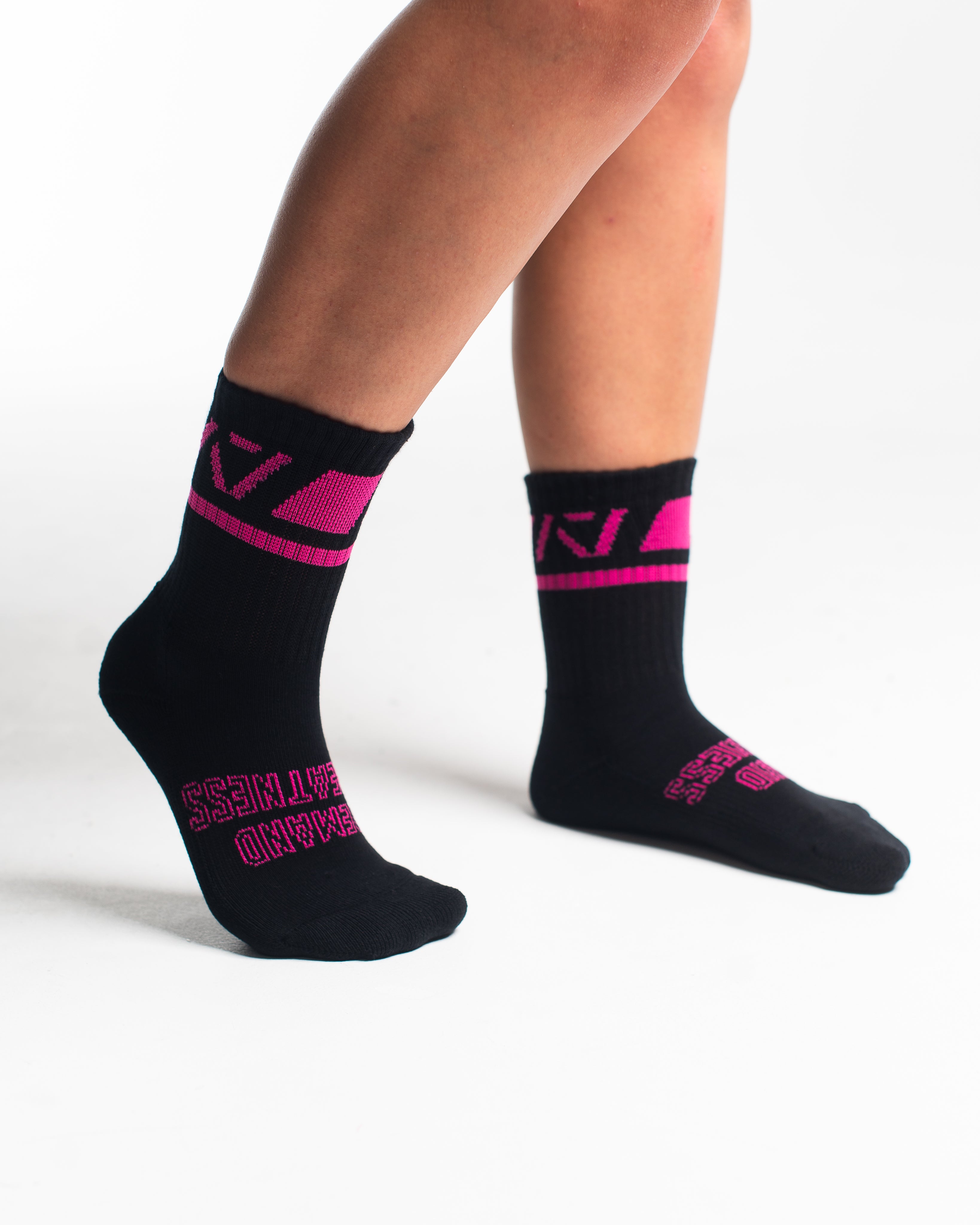 Side profile of A7 Crew Socks in Flamingo, highlighting the A7 logo on the ankle and compression-style top.