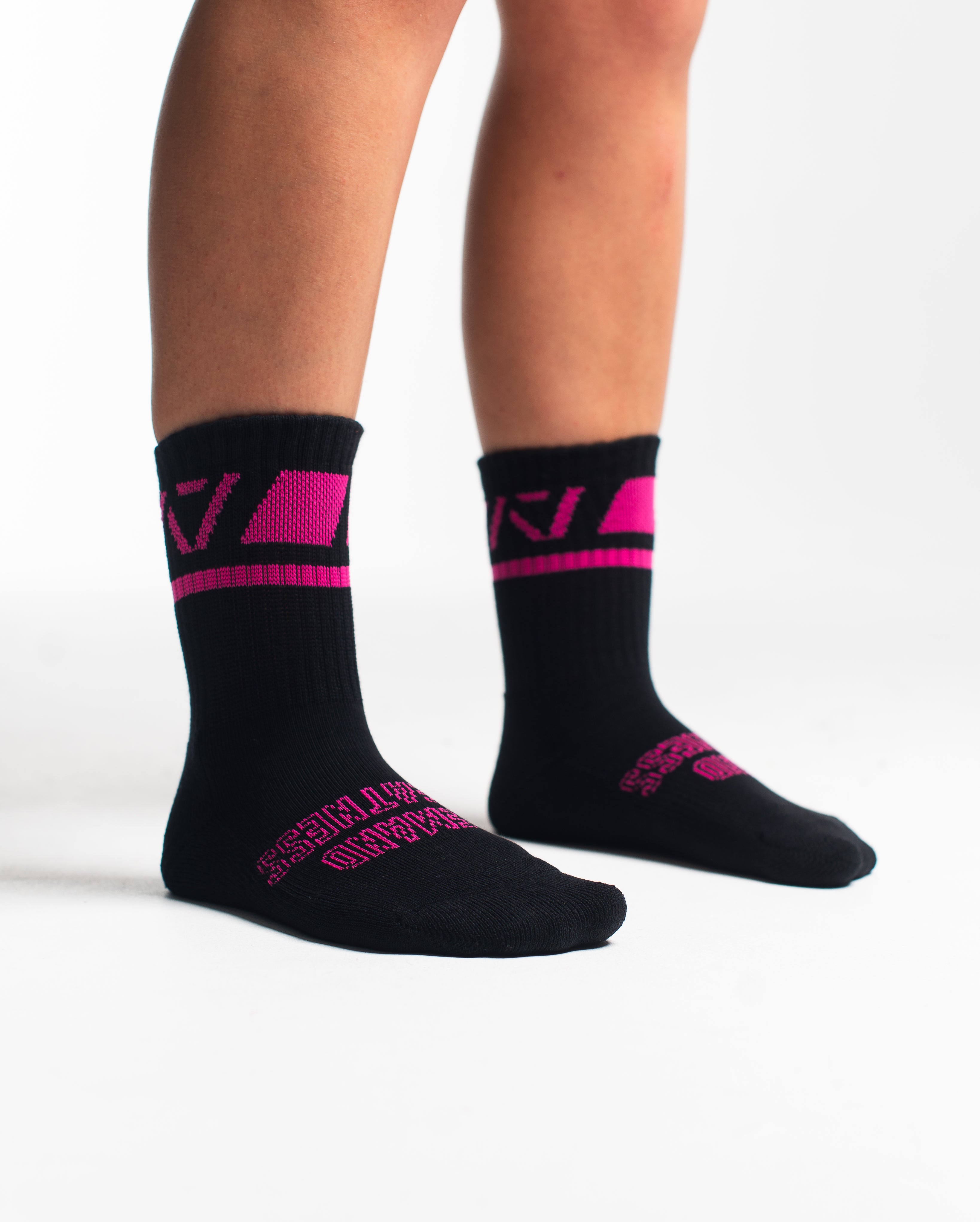Side profile of A7 Crew Socks in Flamingo, highlighting the A7 logo on the ankle and compression-style top.