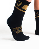 Close-up of the knit fabric on A7 Crew Socks in Gold Standard, showing texture and stitching details.
