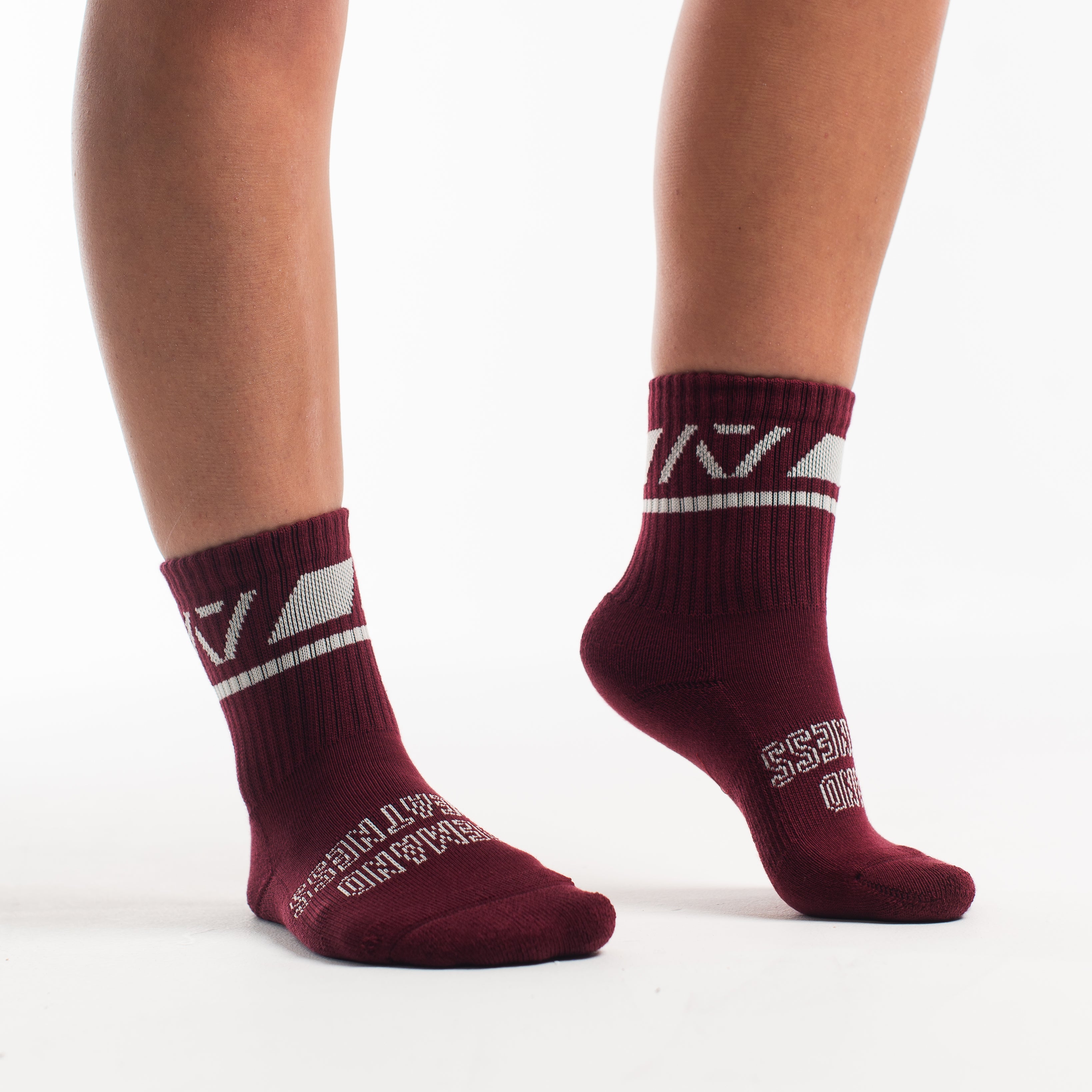 Side profile of A7 Crew Socks in Ivory Rose, highlighting the A7 logo on the ankle and compression-style top.