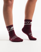 Side profile of A7 Crew Socks in Ivory Rose, highlighting the A7 logo on the ankle and compression-style top.