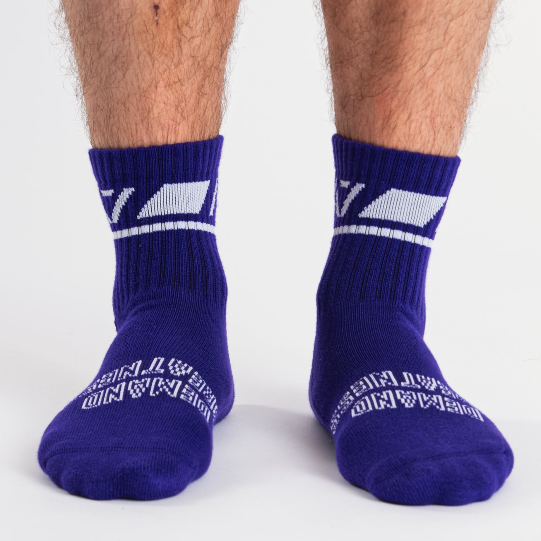 Front view of A7 Crew Socks in Purple, showcasing mid-shin length and ribbed cuff design.