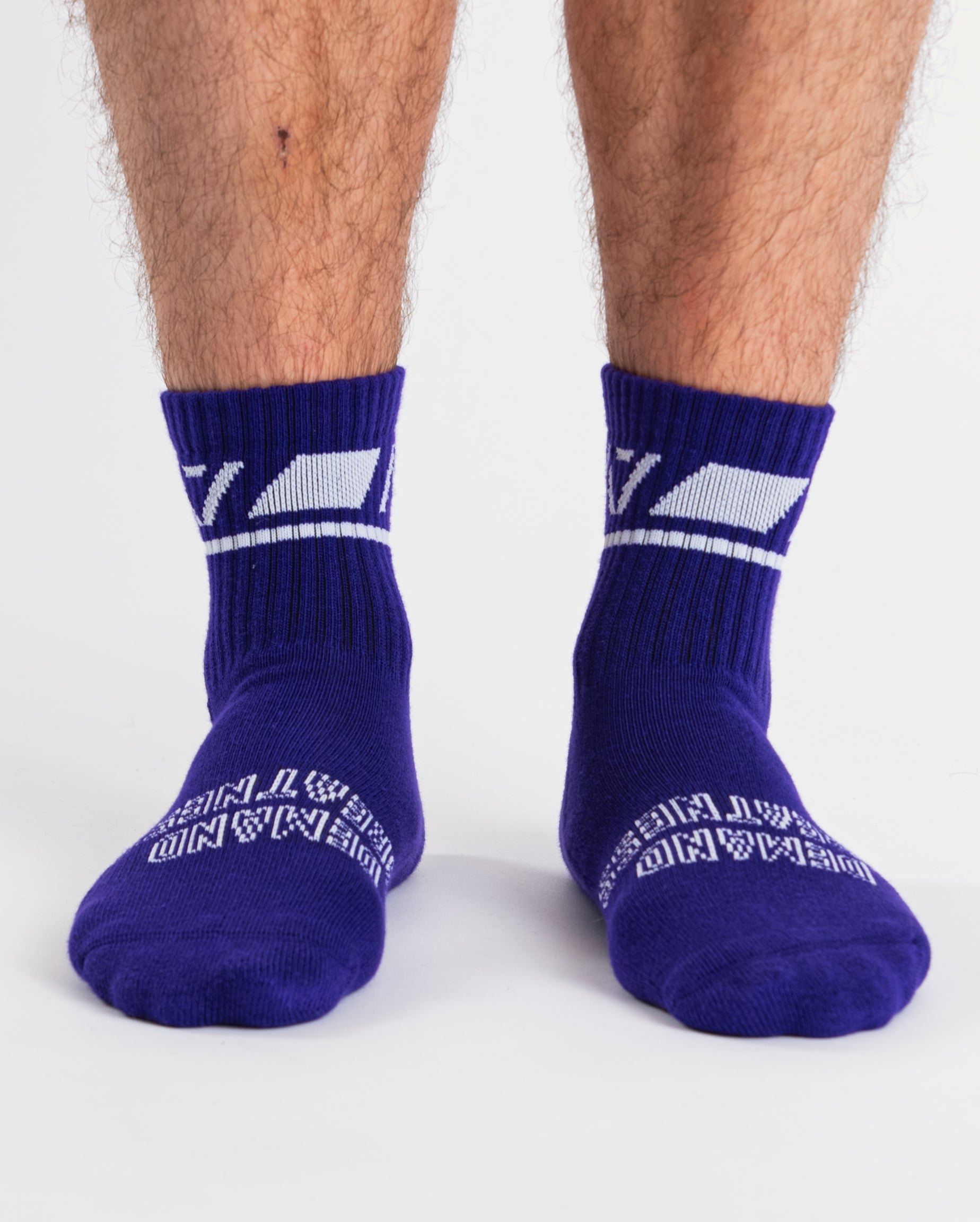 Front view of A7 Crew Socks in Purple, showcasing mid-shin length and ribbed cuff design.