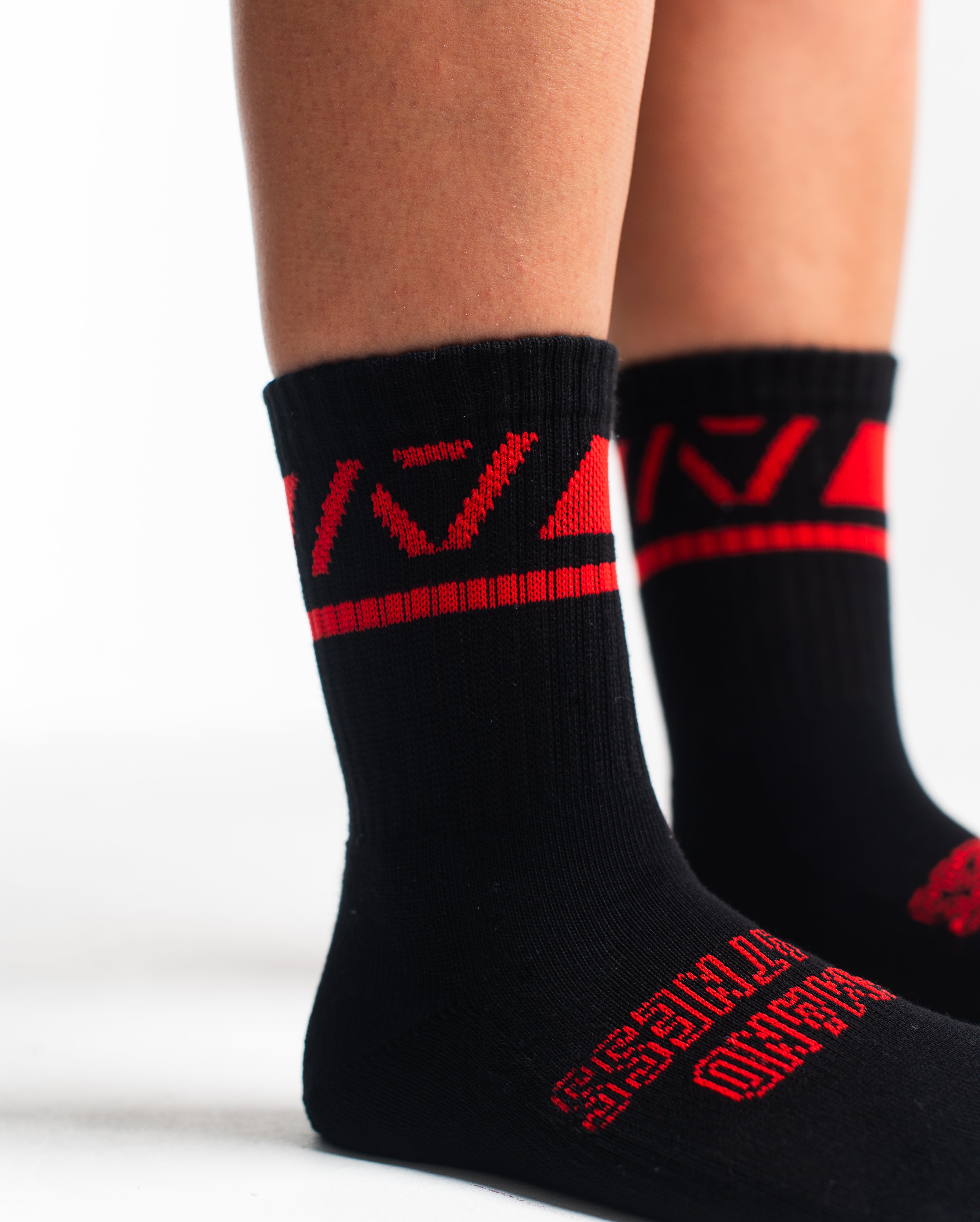Close-up of the knit fabric on A7 Crew Socks in Red Dawn, showing texture and stitching details.