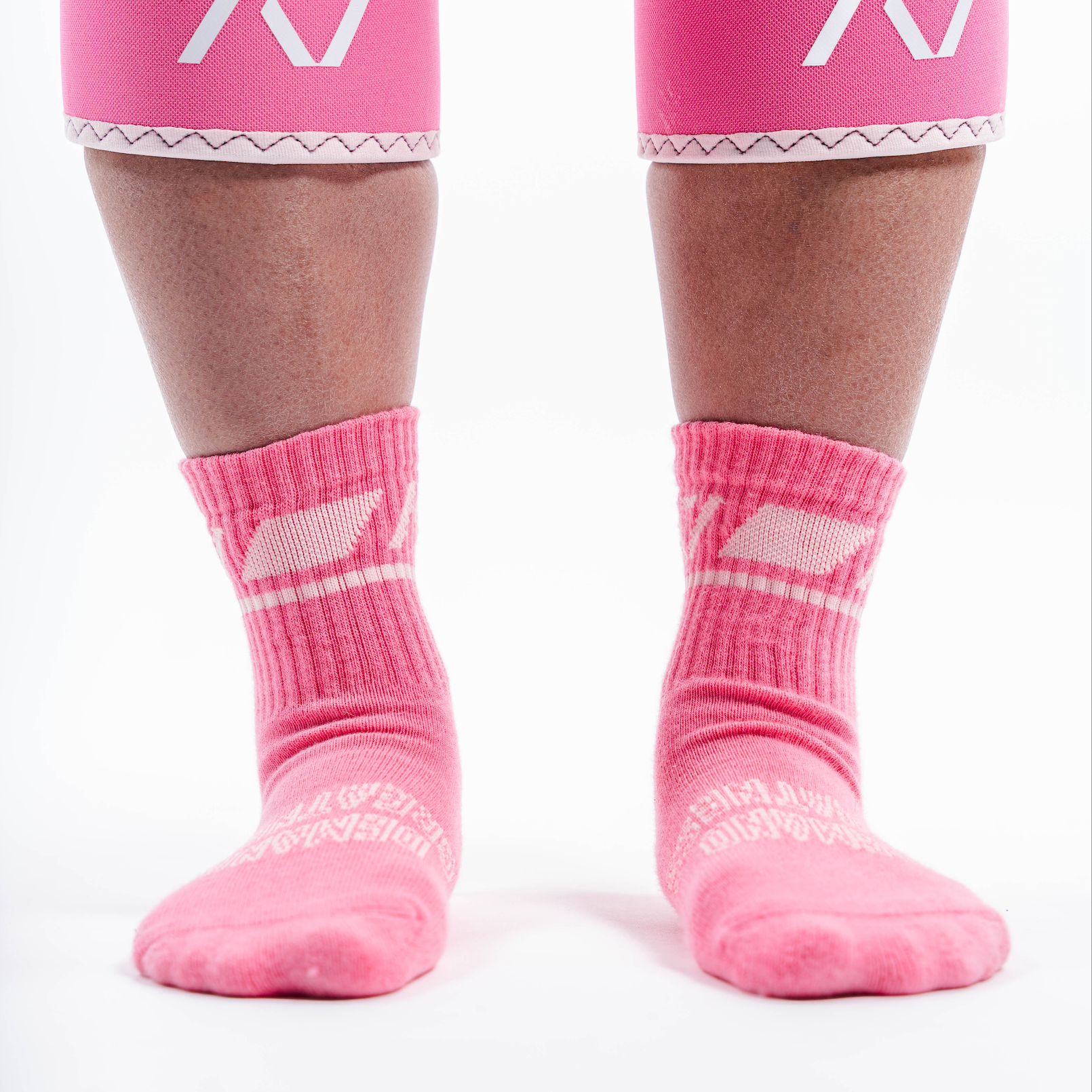 Front view of A7 Crew Socks in Roseite, showcasing mid-shin length and ribbed cuff design.