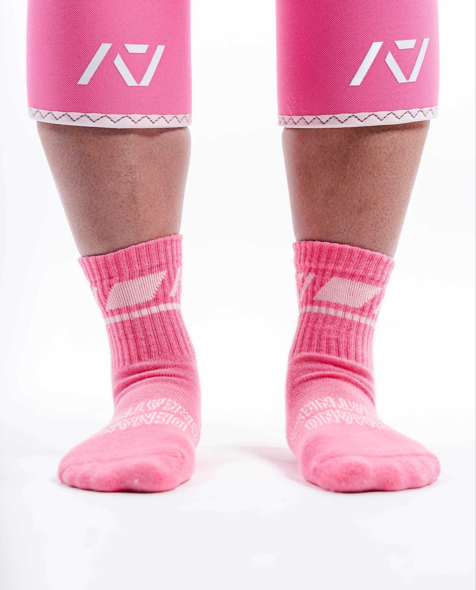 Front view of A7 Crew Socks in Roseite, showcasing mid-shin length and ribbed cuff design.