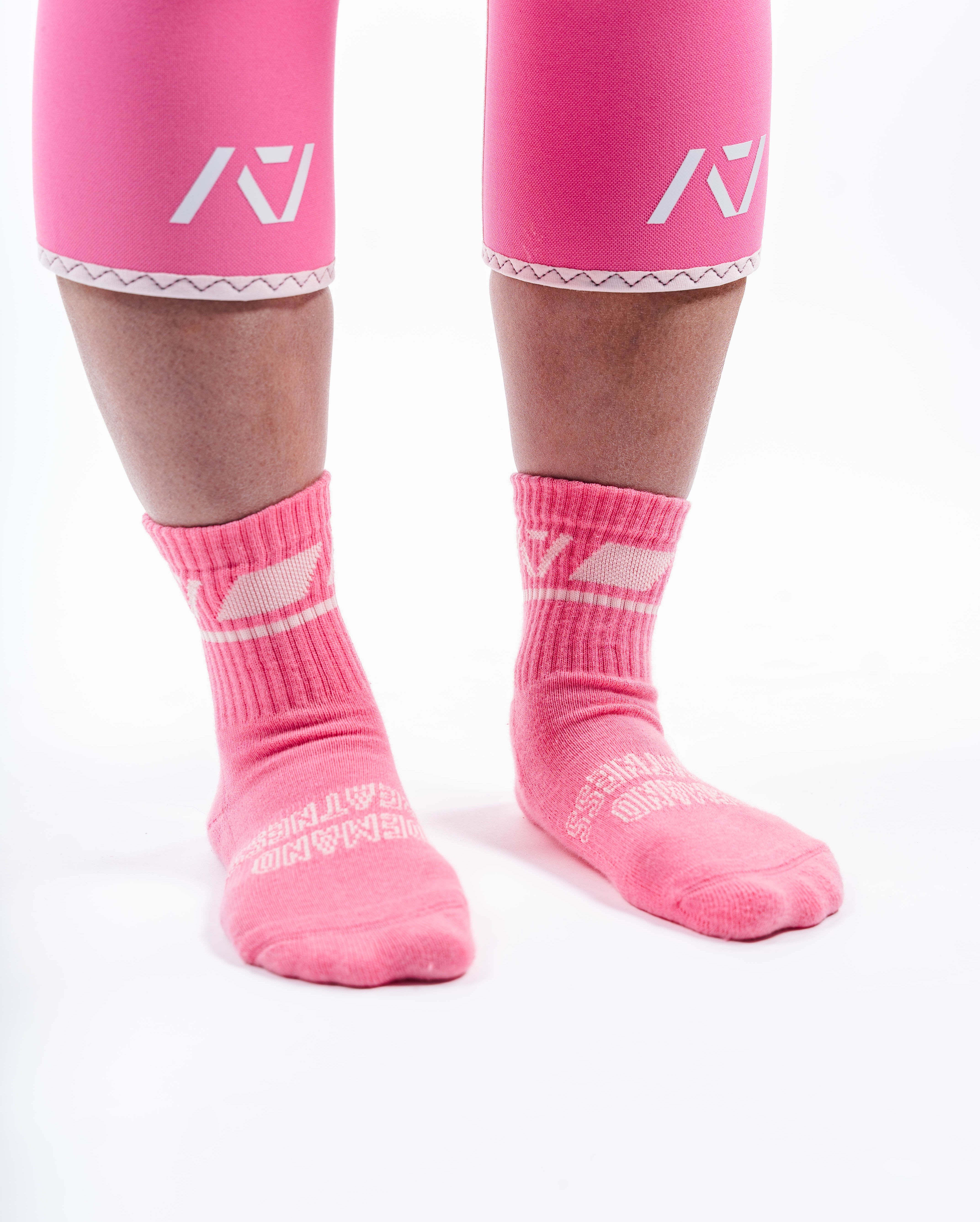 Side profile of A7 Crew Socks in Roseite, highlighting the A7 logo on the ankle and compression-style top.