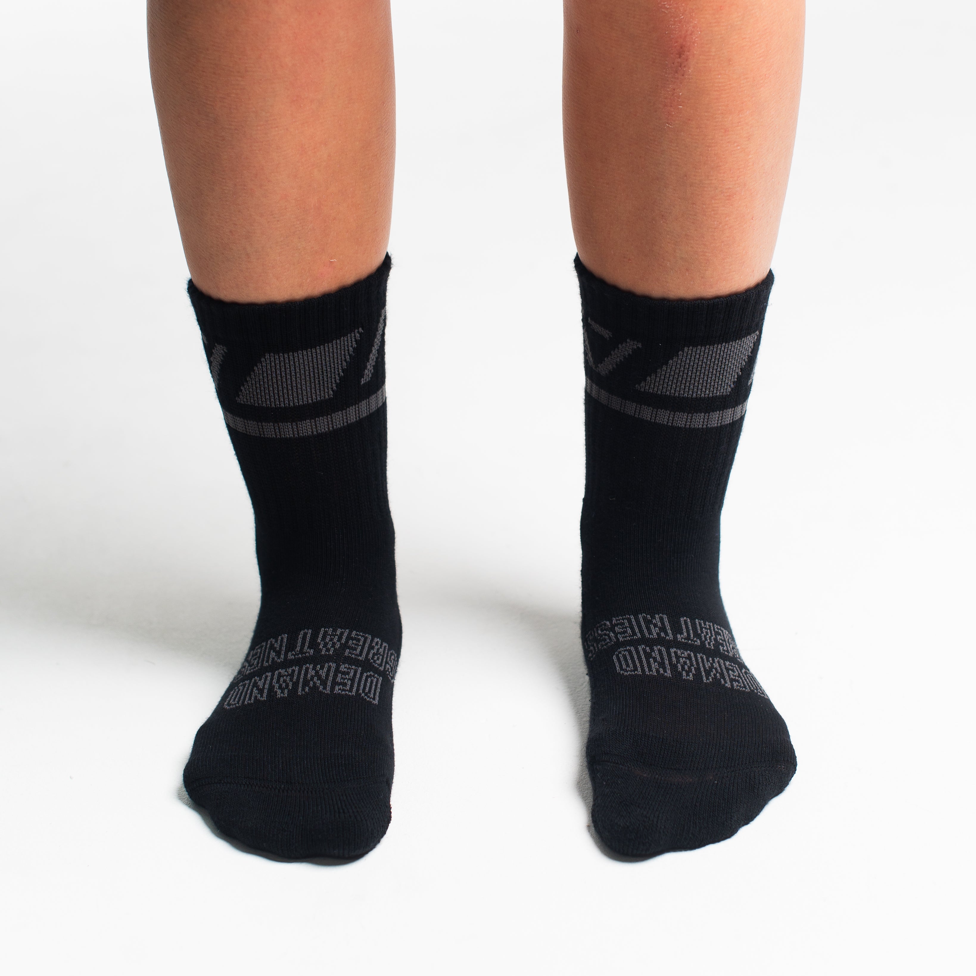 Front view of A7 Crew Socks in Shadow Stone, showcasing mid-shin length and ribbed cuff design.
