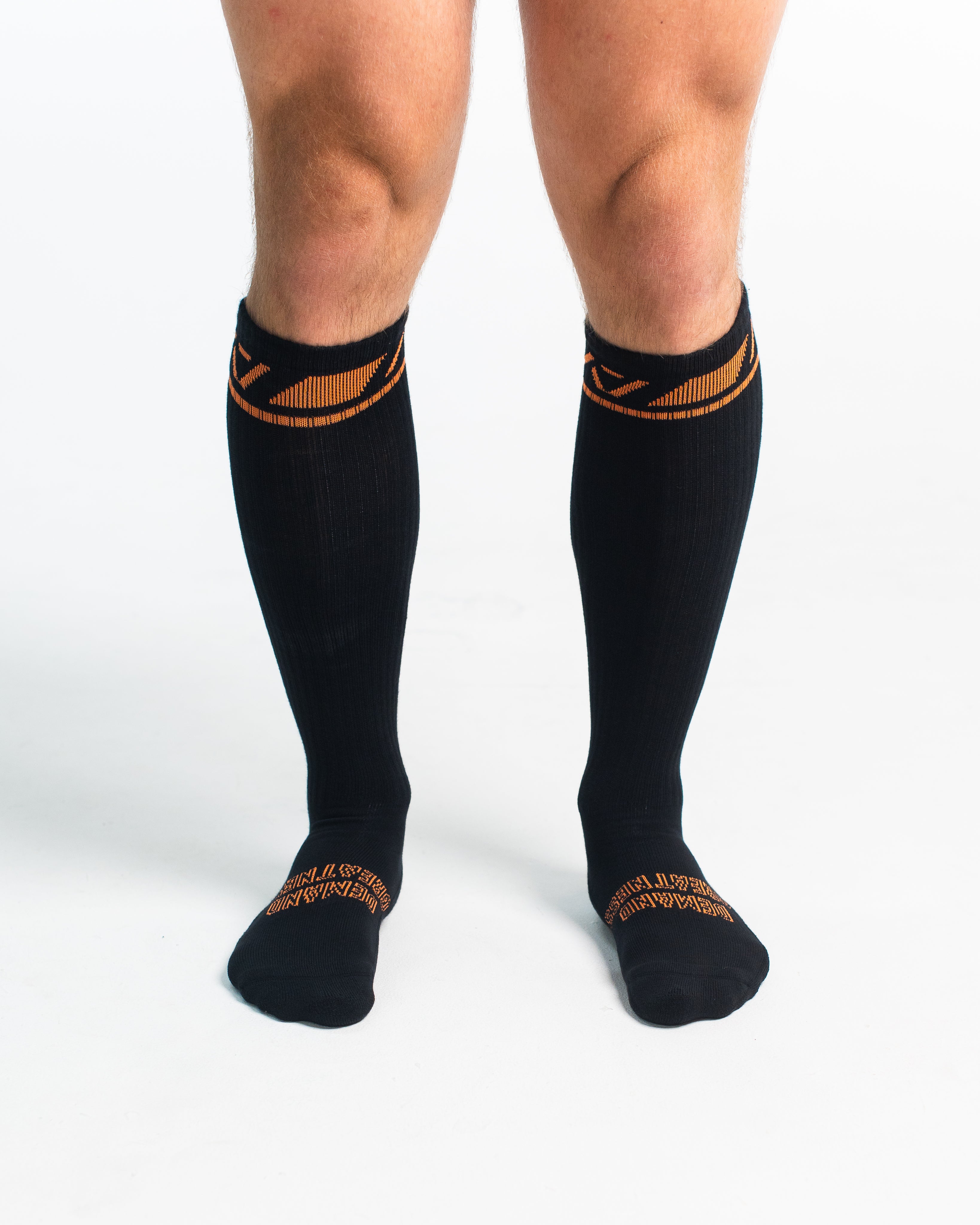 Front view of A7 Deadlift Socks in Blaze, showcasing mid-shin length and ribbed cuff design