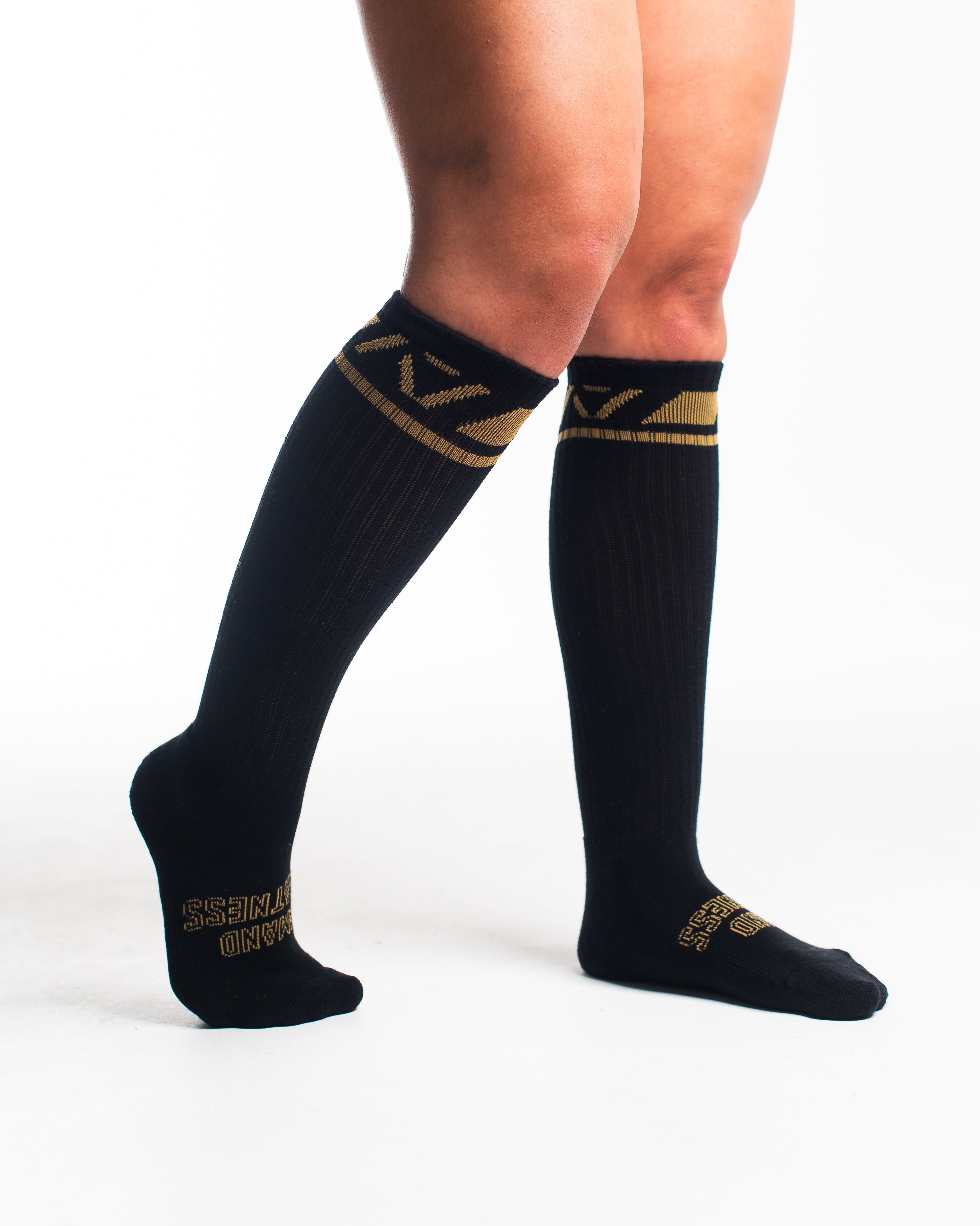 Side profile of A7 Deadlift Socks in Gold Standard, highlighting the A7 logo on the ankle and compression-style top.
