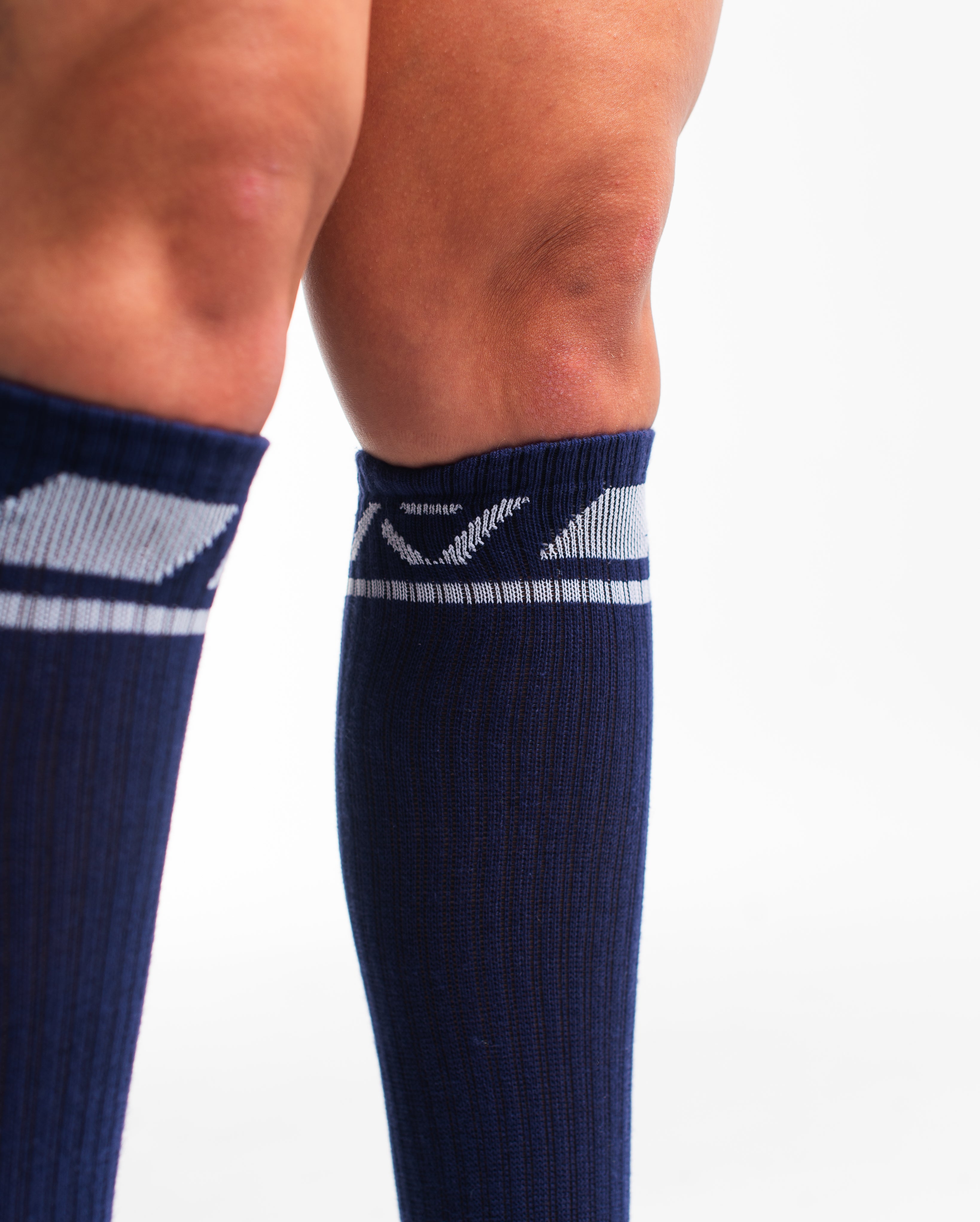 Close-up of the knit fabric on A7 Deadlift Socks in Night Light, showing texture and stitching details.