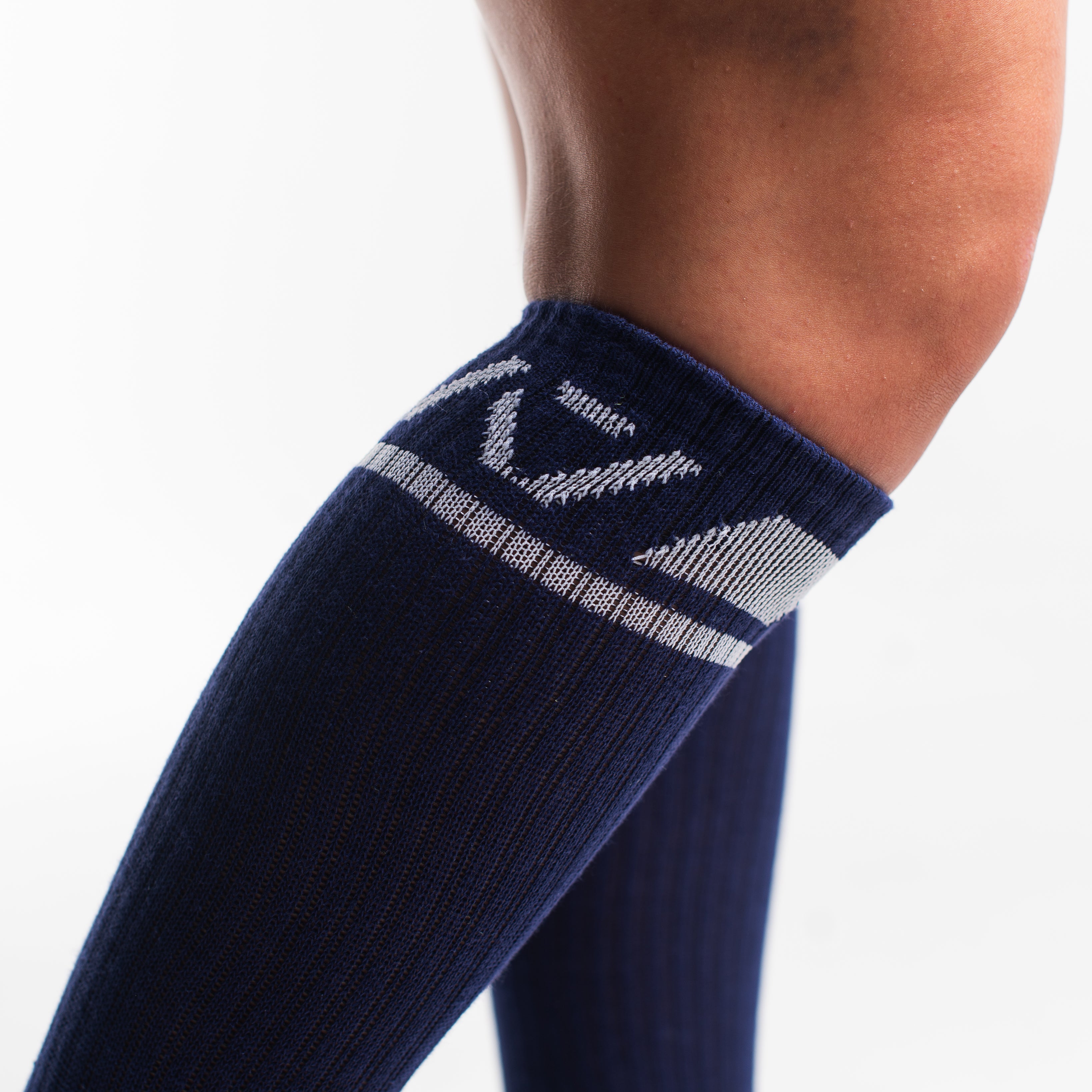 Close-up of the knit fabric on A7 Deadlift Socks in Night Light, showing texture and stitching details.
